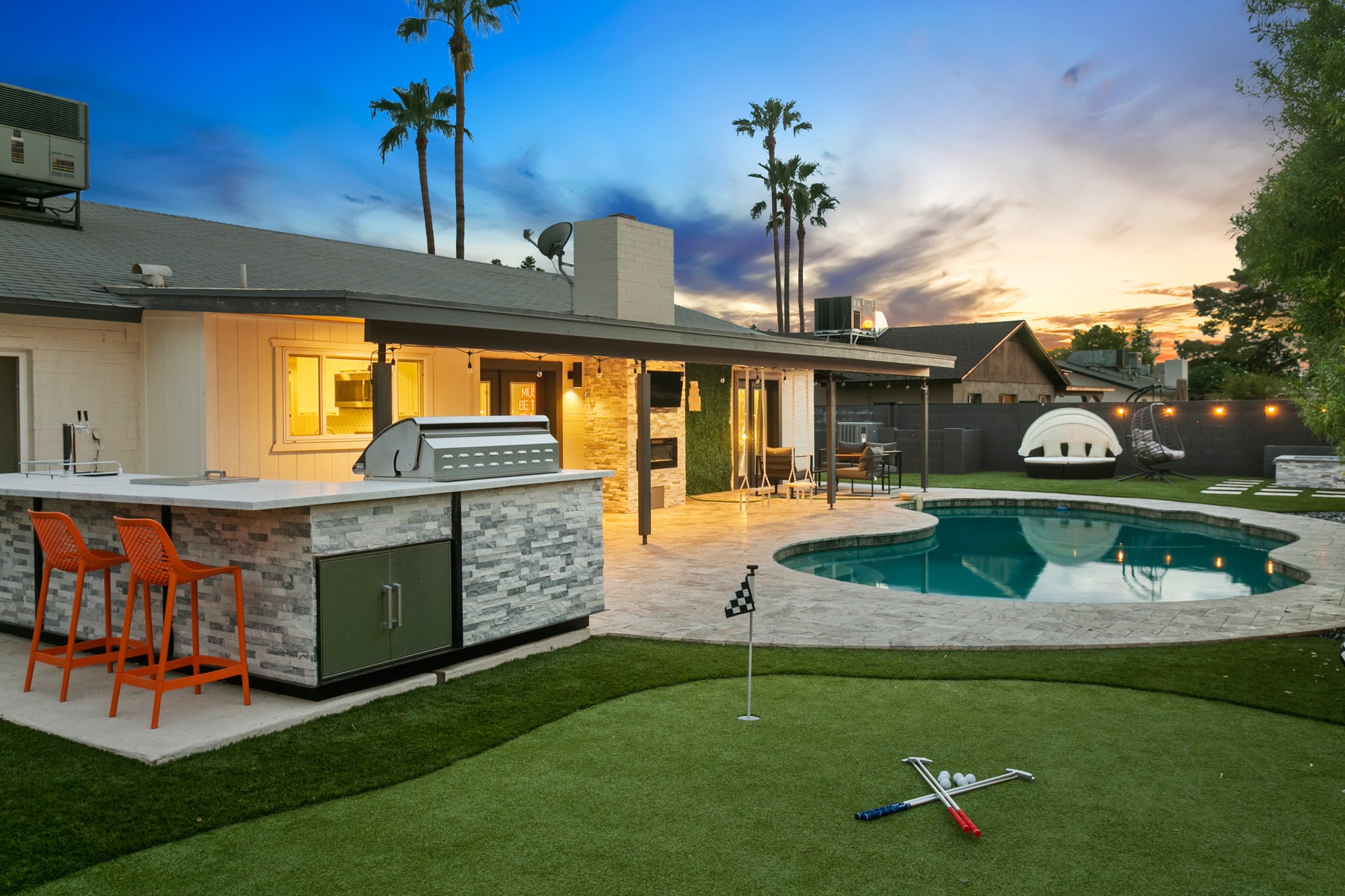 Your paradise backyard- putt putt, firepit, wet bar, BBQ Grill, cornhole, connect 4, and tons of outdoor seating