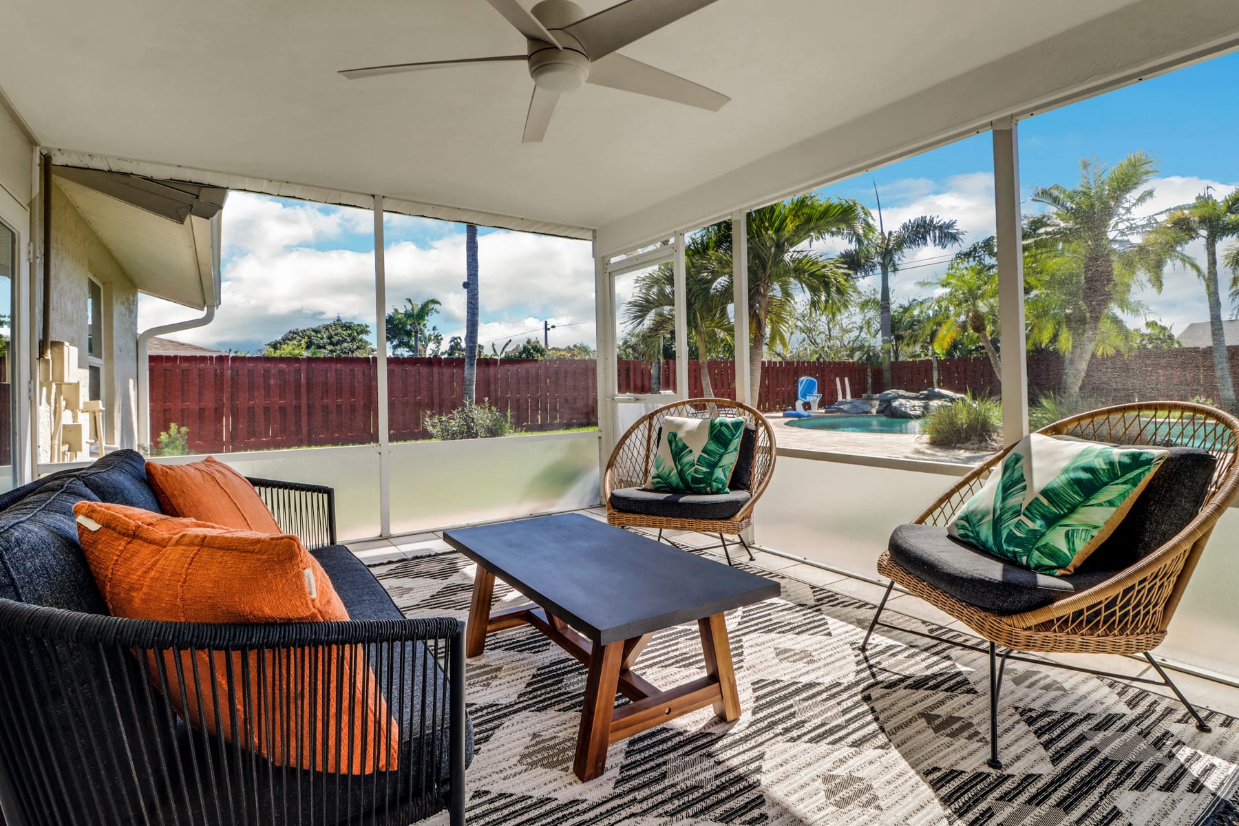 If the perfect outdoor living room isn't your thing, maybe this wonderful screened in porch overlooking the pool is :)