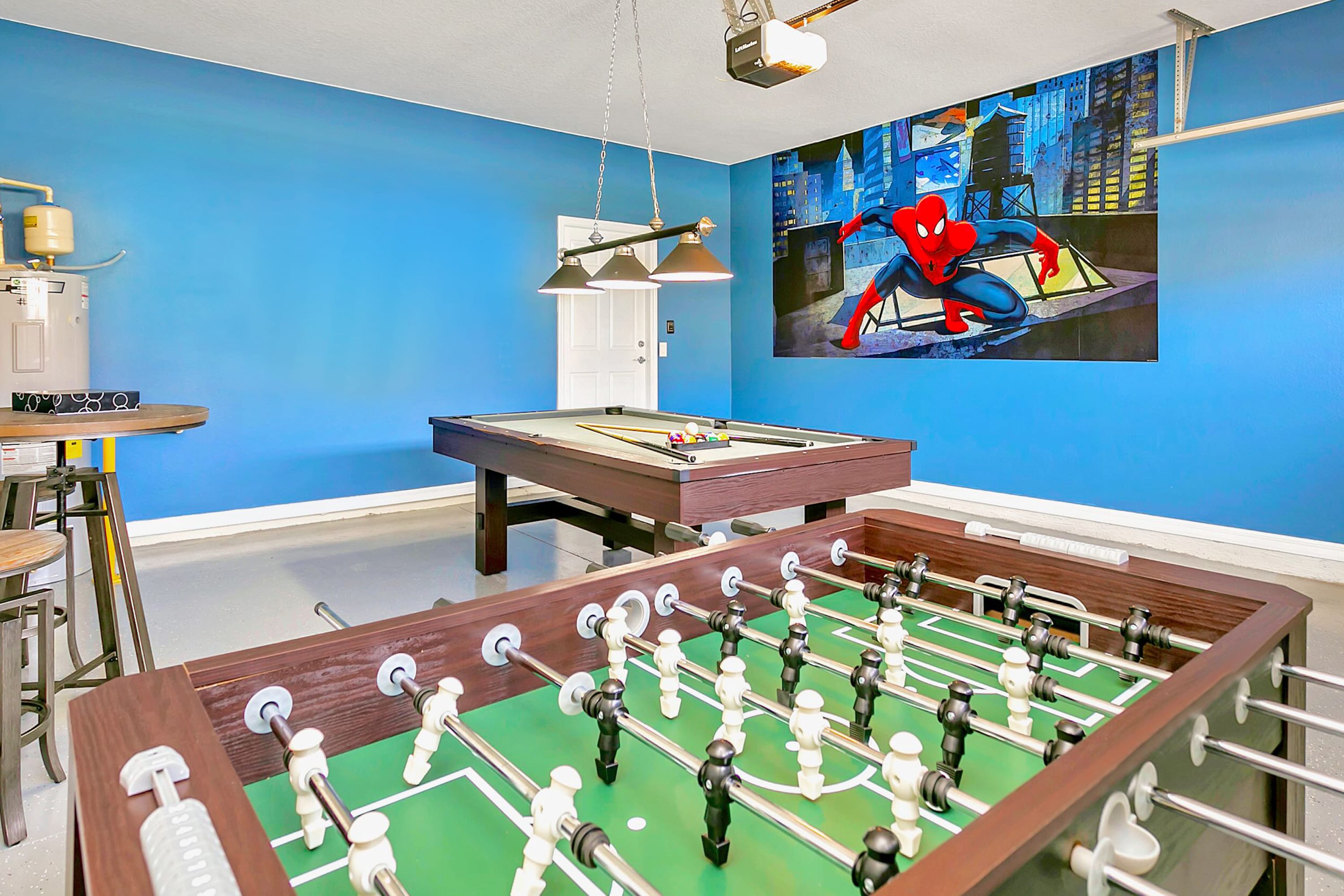 In-house games room with foosball, billiards and big screen TV