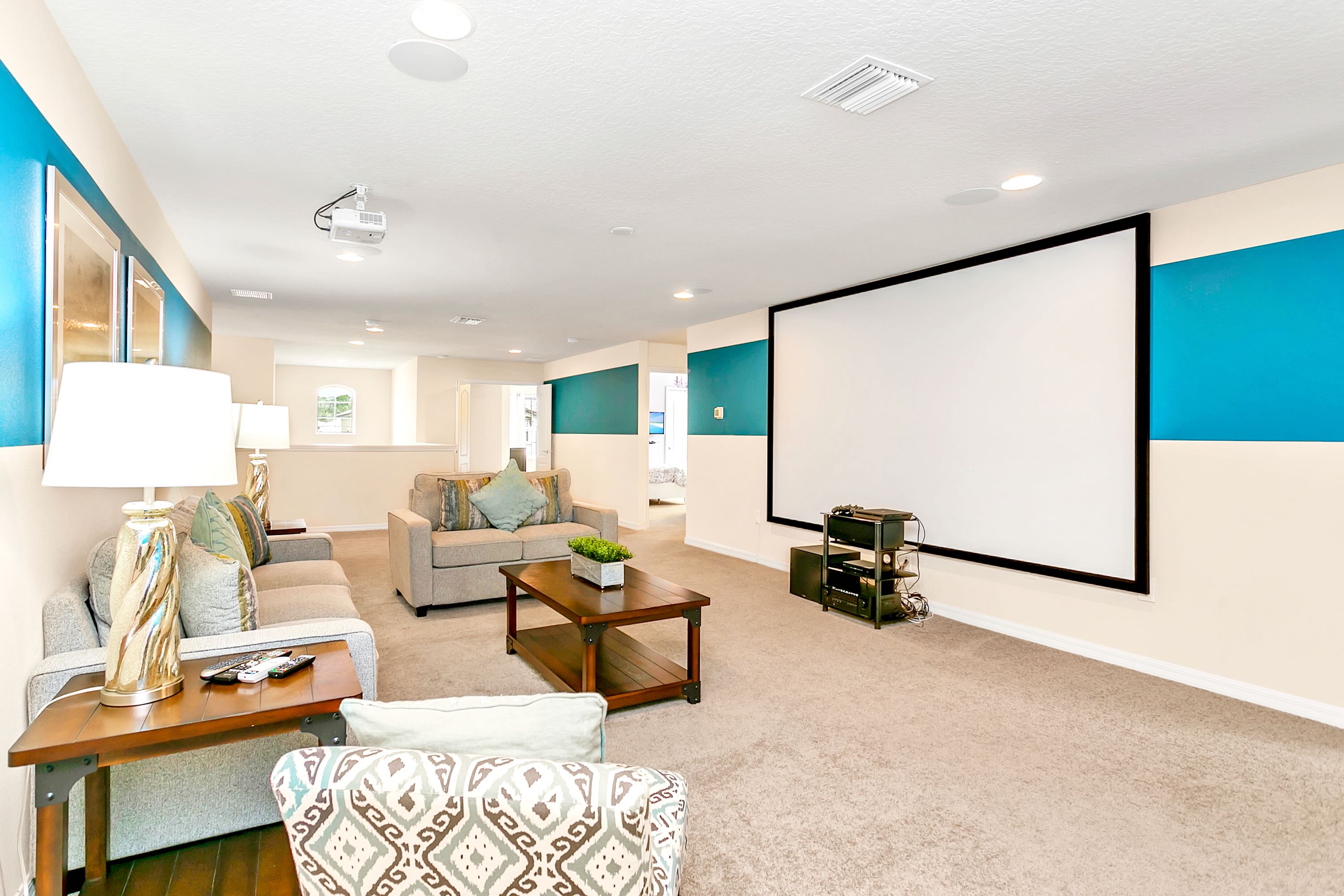In-home movie theatre with massive projection screen.