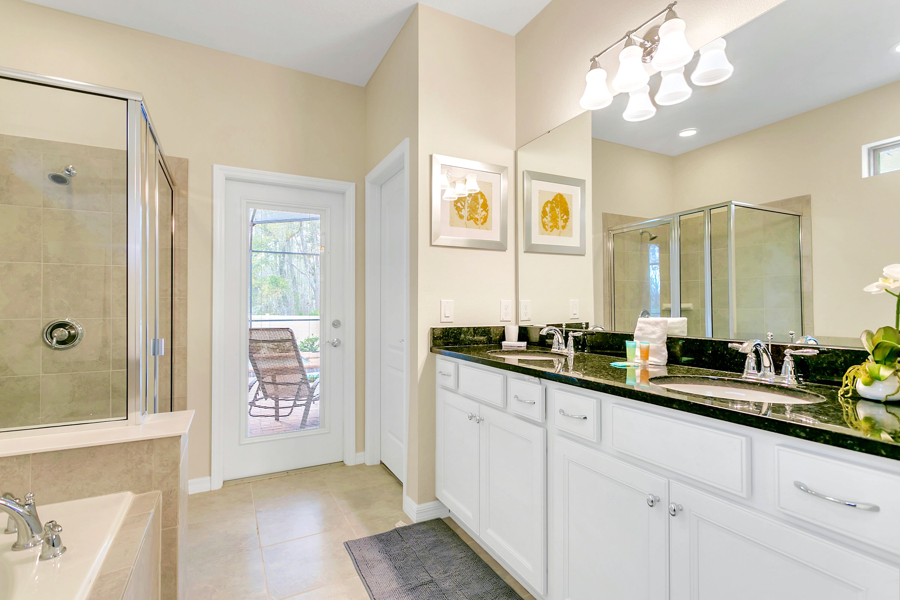 Spacious And Elegant Bathroom With Double Sinks And A Walking Shower