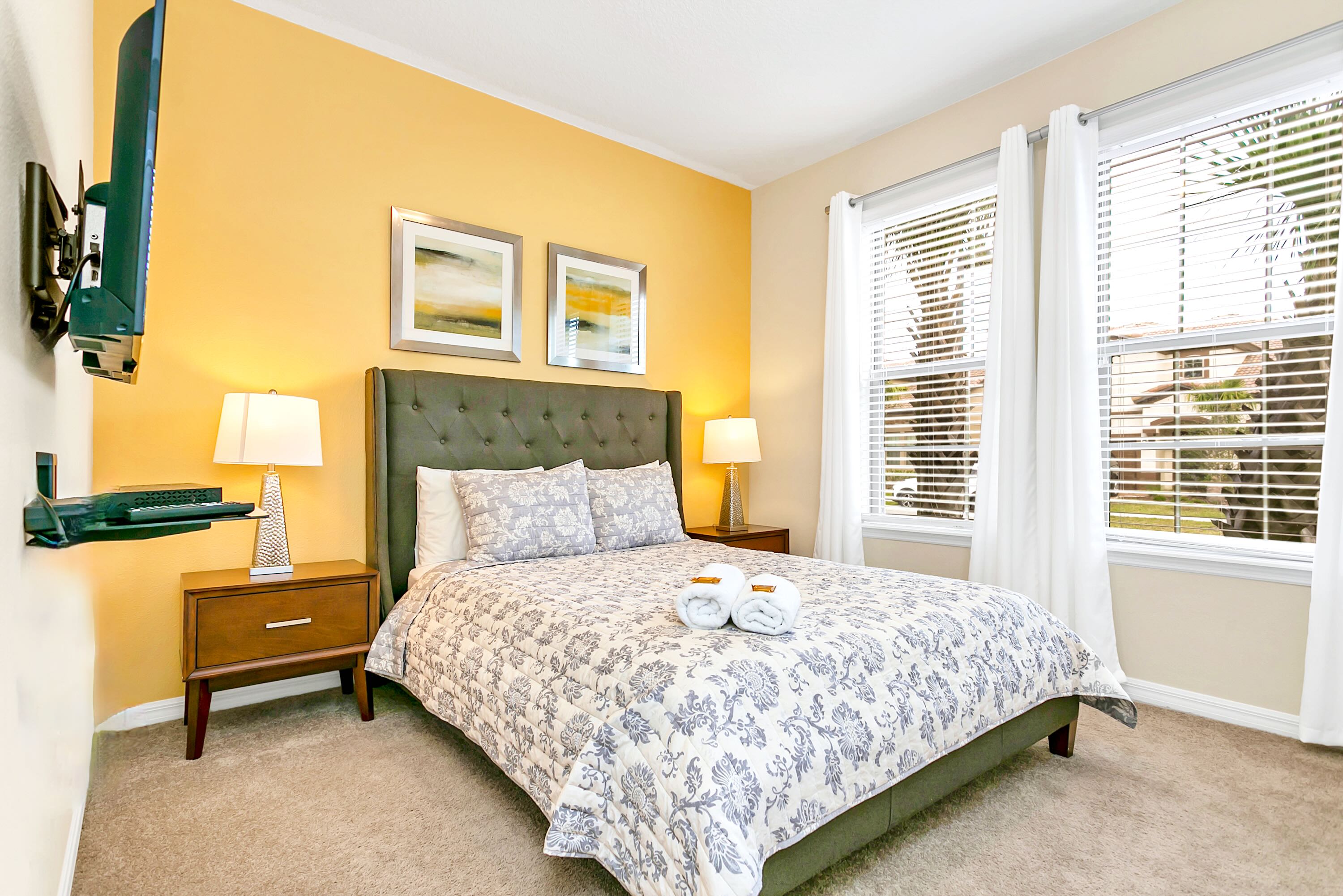 Elegant Bedroom With Queen Bed And Smart Tv