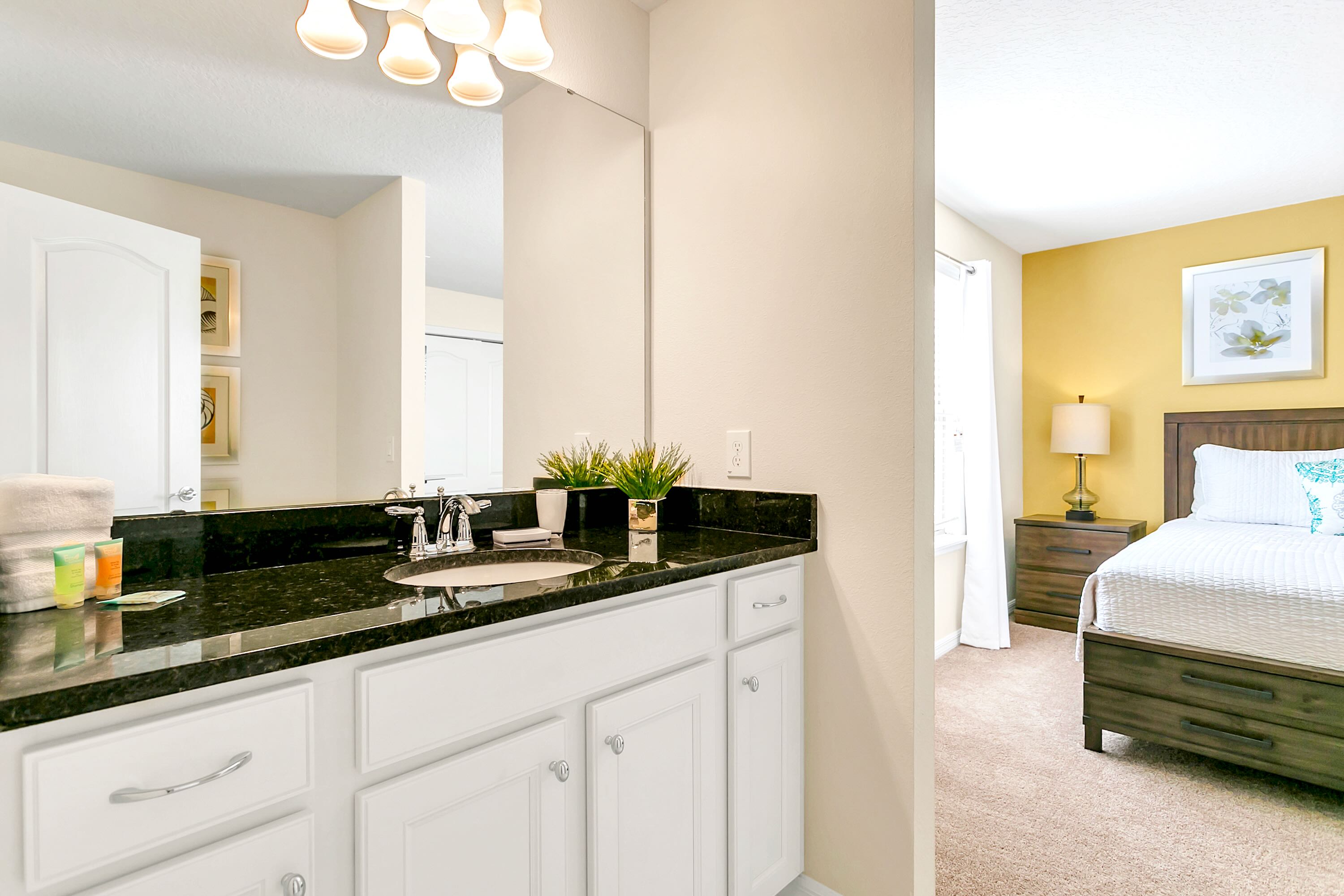 Spacious And Elegant Bathroom With Double Sinks And A Walking Shower