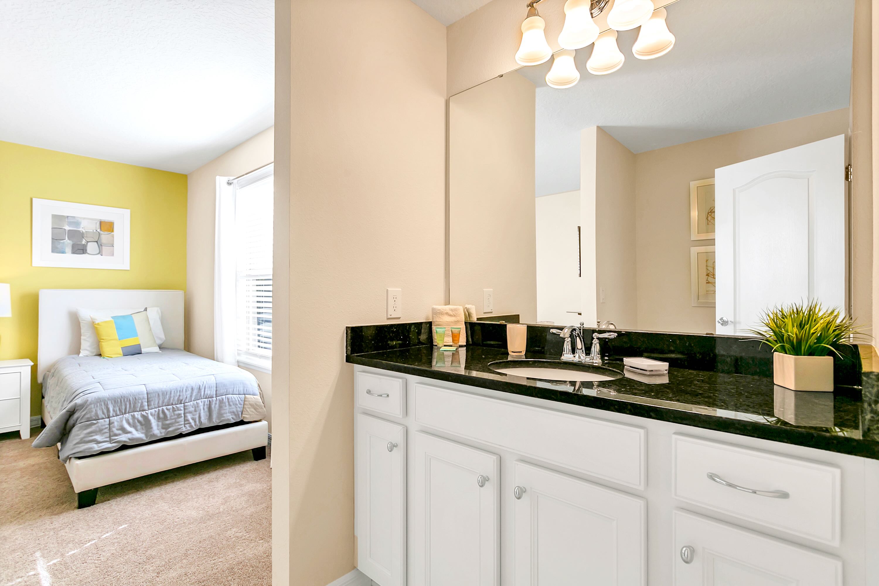 Spacious And Elegant Bathroom With Double Sinks And A Walking Shower