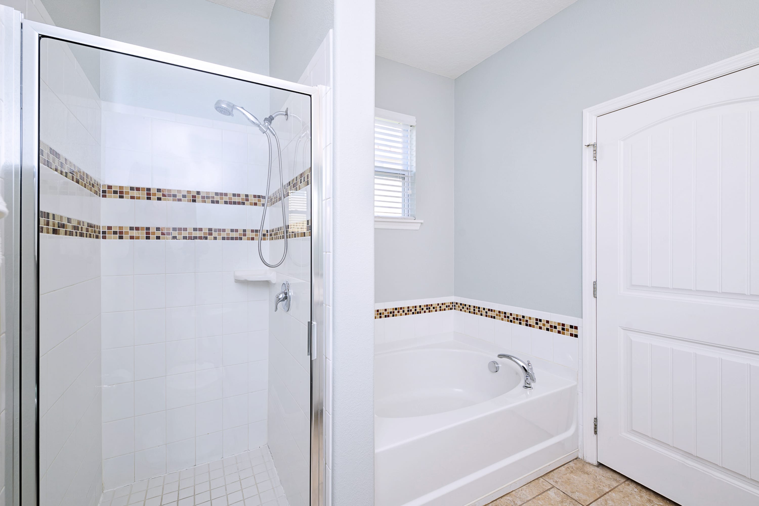 Ground Level King Bedroom Ensuite with Large Soaker Tub and Standing Shower