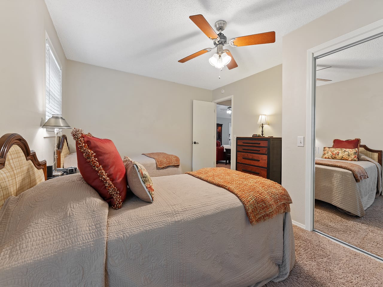 The third bedroom connects directly to the back deck