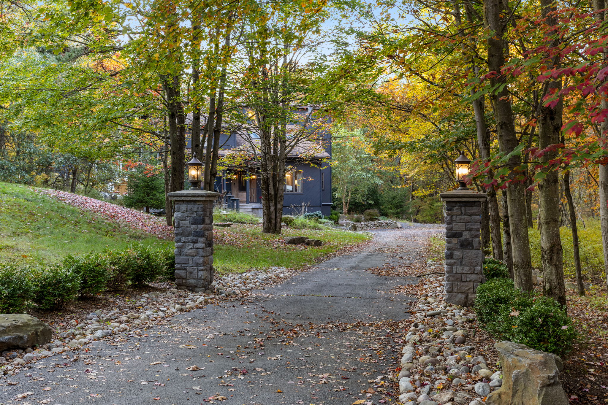 Scenic Driveway Entrance – A charming tree-lined driveway welcomes you to this secluded retreat.