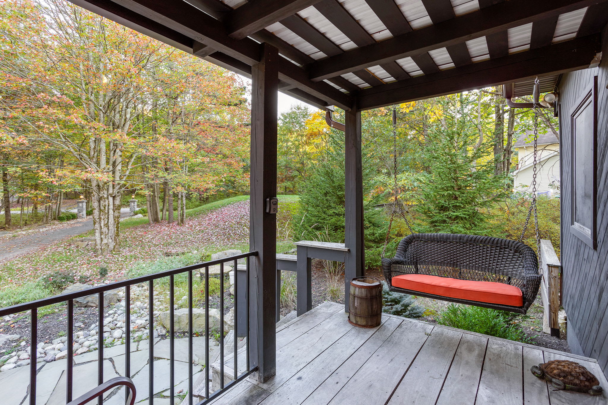 Charming Porch with Garden Views – A beautifully crafted porch with stunning natural surroundings.