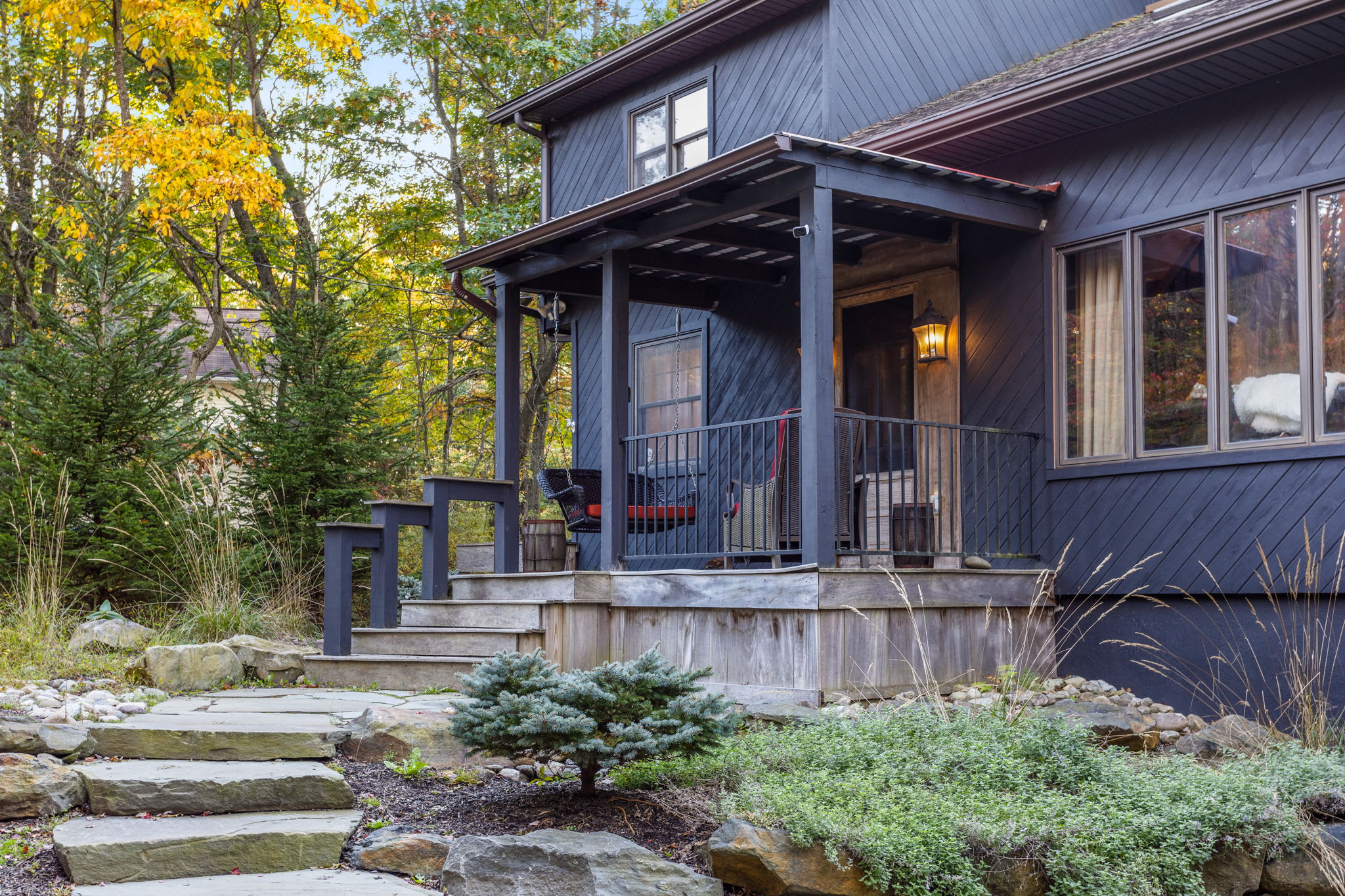 Rustic Porch with Nature Views – A perfect spot to sip morning coffee while taking in the serene landscape.