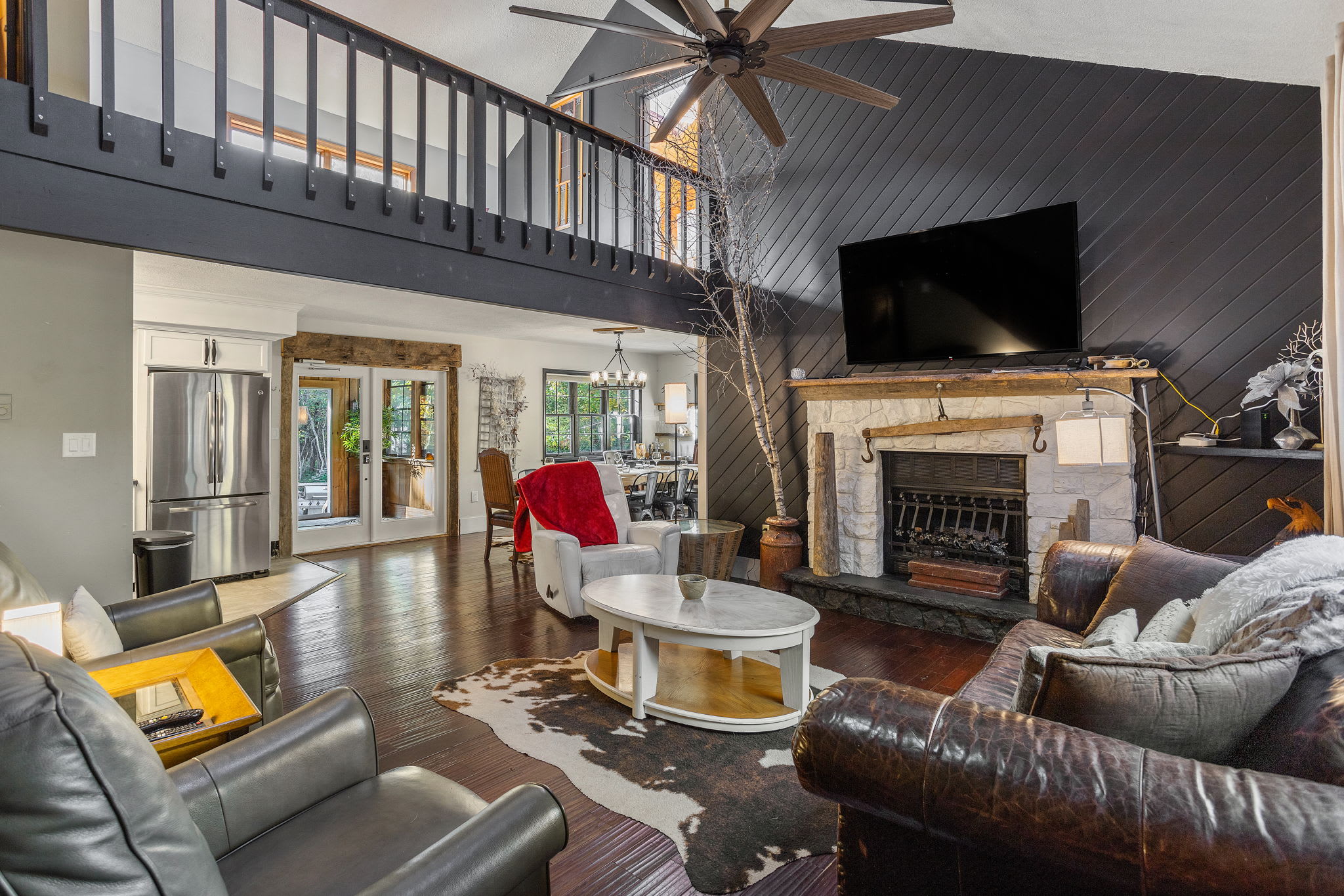 Spacious Living Room with Fireplace – Gather around the fireplace in this beautifully designed living space.