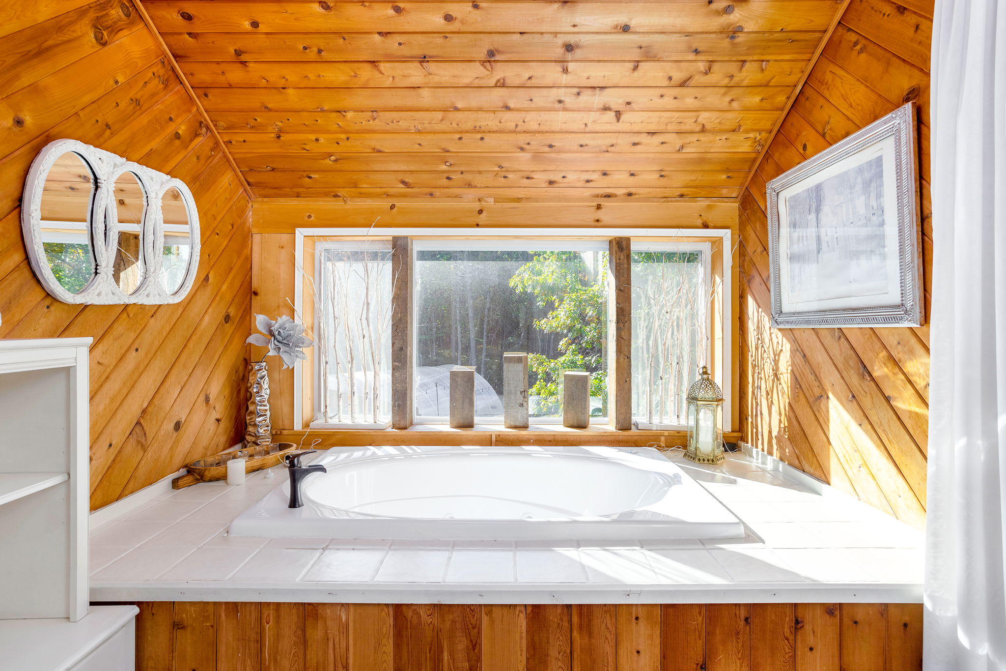 Cedar-clad walls and a skylight transform this corner into a serene spa-like retreat.