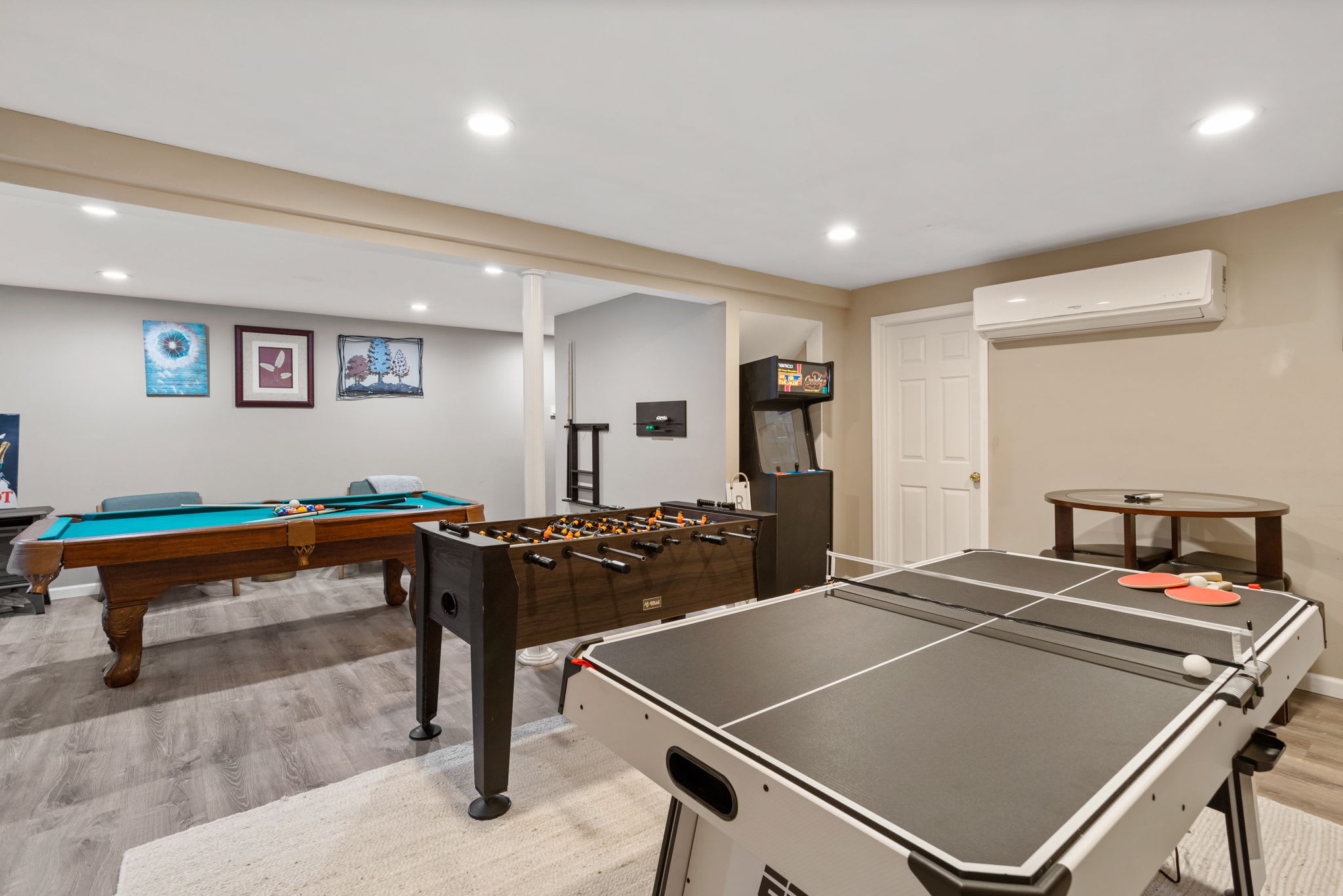 From this angle, the room’s full lineup pool, foosball, ping-pong, and arcade comes into view, guaranteeing there’s something for everyone.