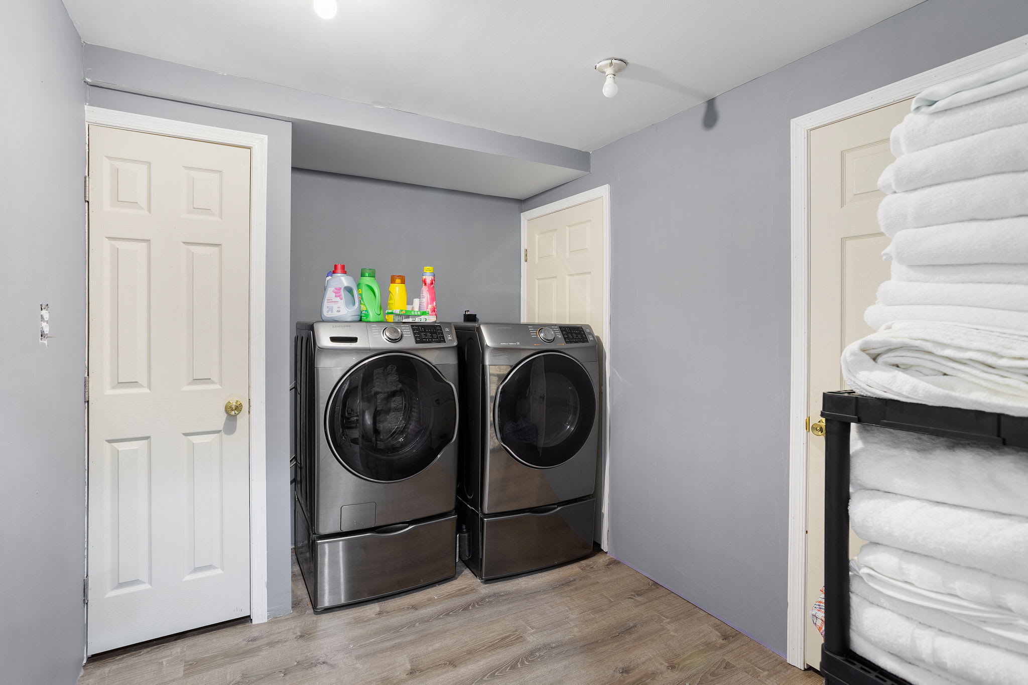 A convenient laundry nook with full-size appliances keeps everyday chores simple, stocked with essentials for your stay.