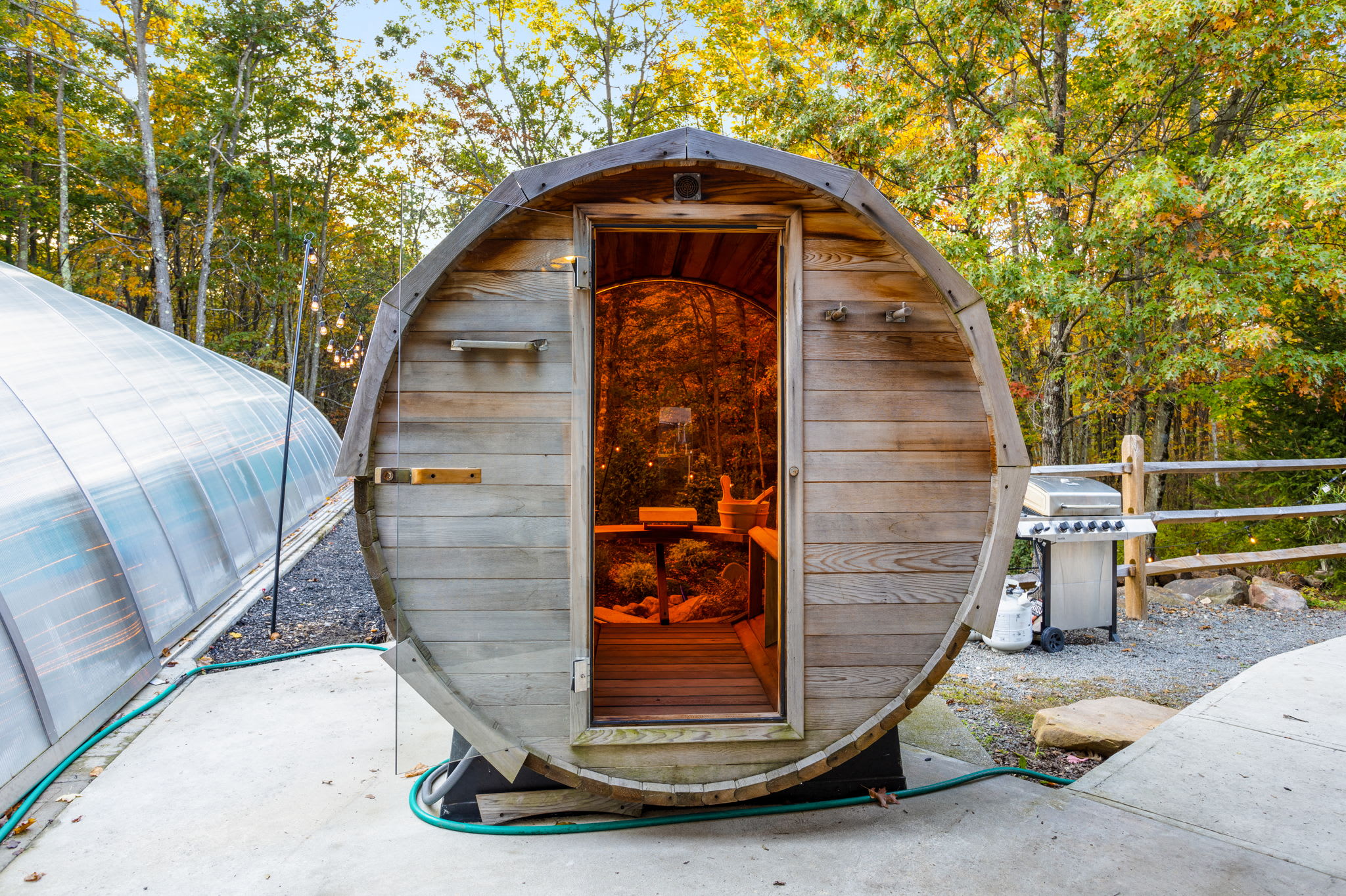 Step into the warm glow of the barrel sauna, a private oasis designed to melt away stress in the fresh mountain air.
