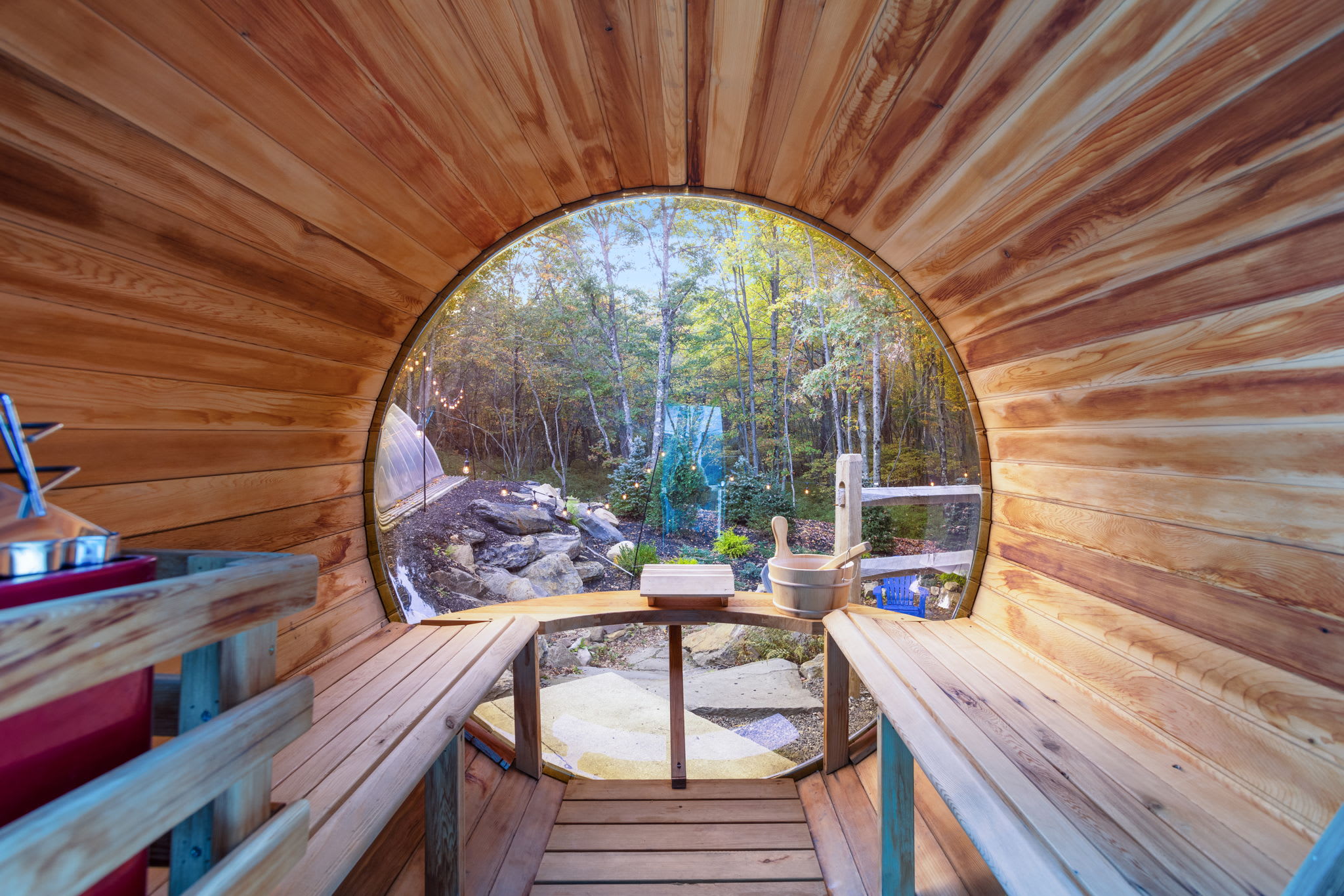 Step inside the barrel sauna and take in a panoramic forest view through its circular window. The cedar walls give off a gentle, woodsy aroma that instantly relaxes you.