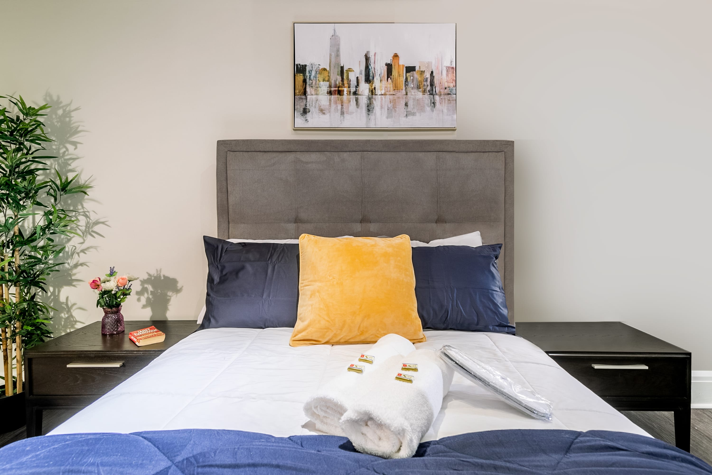 Elegant Bedroom With A Cozy Work Desk And Vibrant Decor