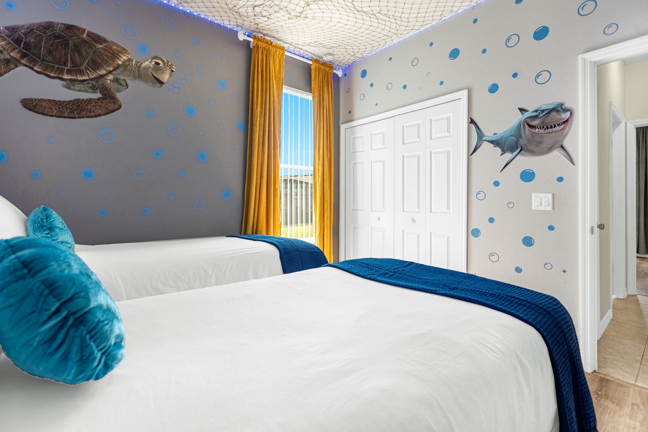 Colorful Kids Bedroom With Twin Beds And Underwater Mural
