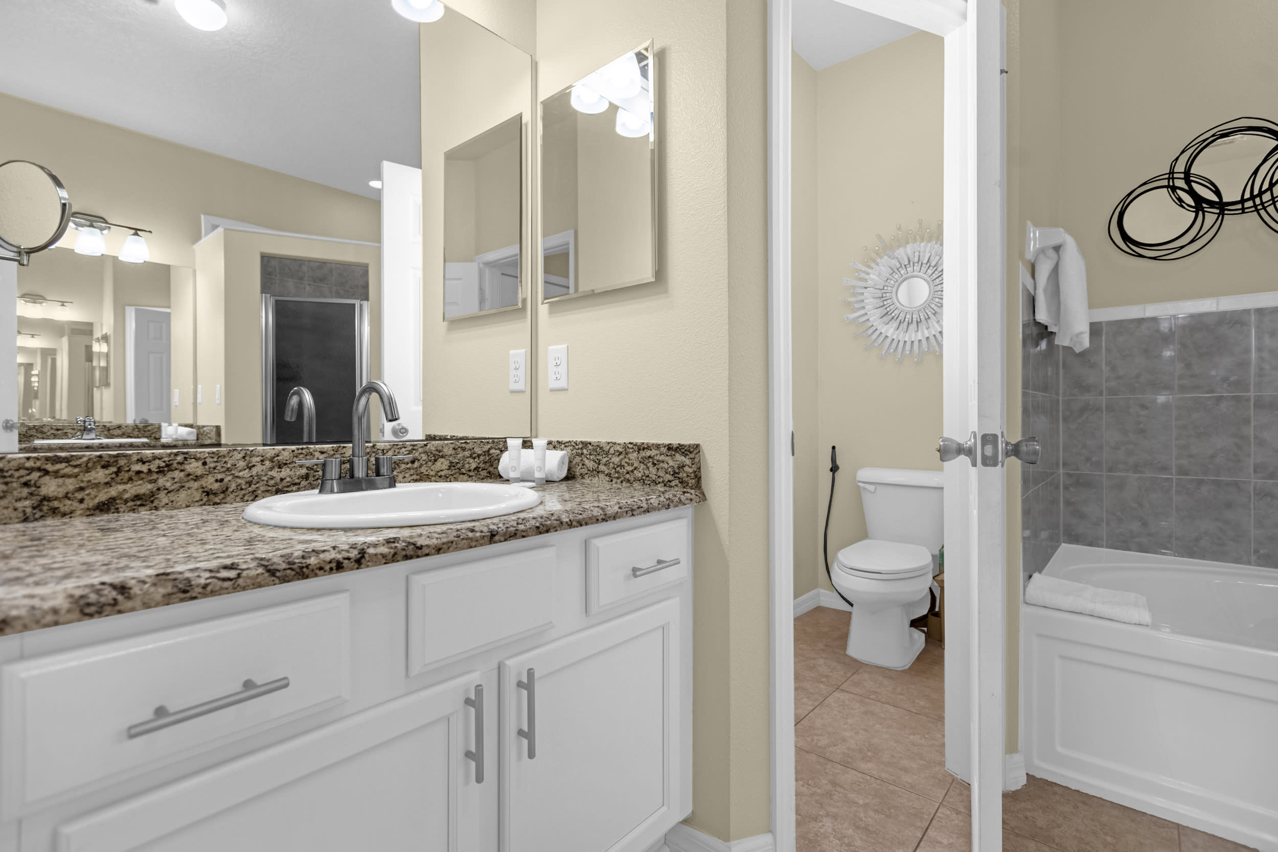 Primary bedroom ensuite with soaker tub and large walk-in shower. 