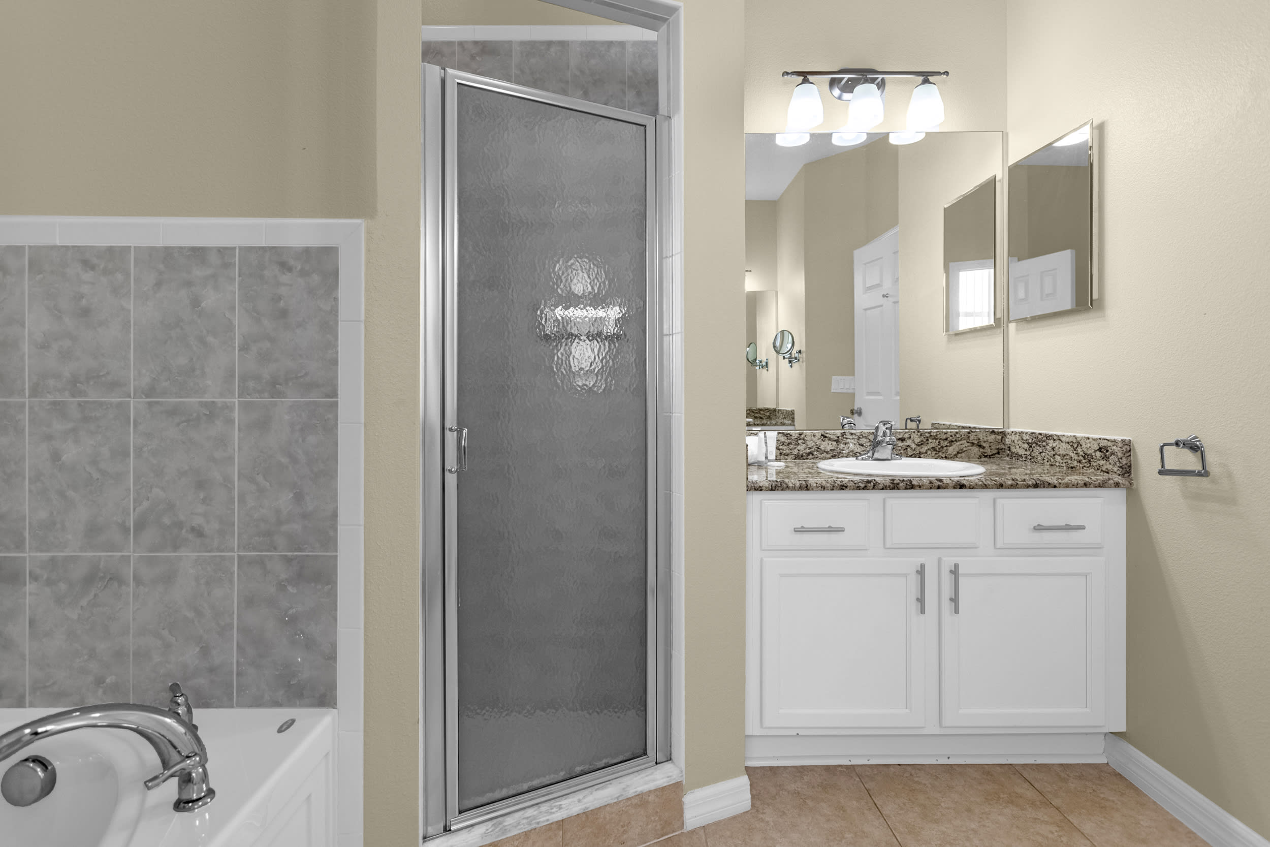 Primary bedroom ensuite has jack and jill vanities. 