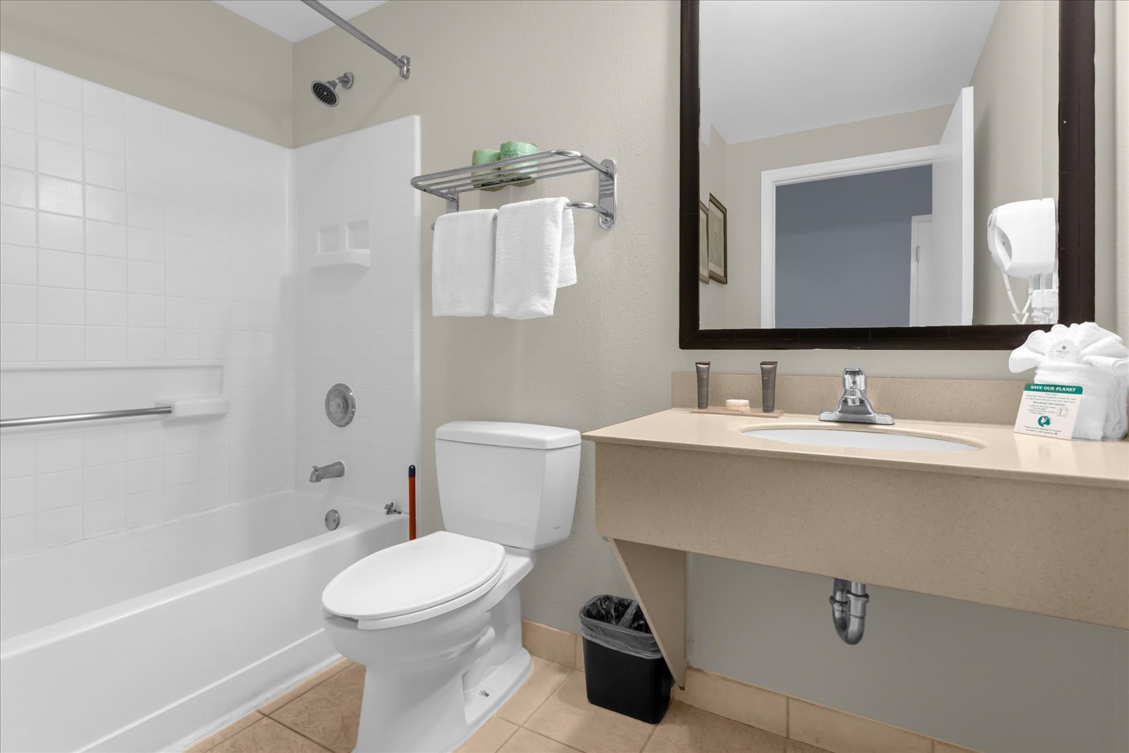 Full bathroom with combined shower and bathtub