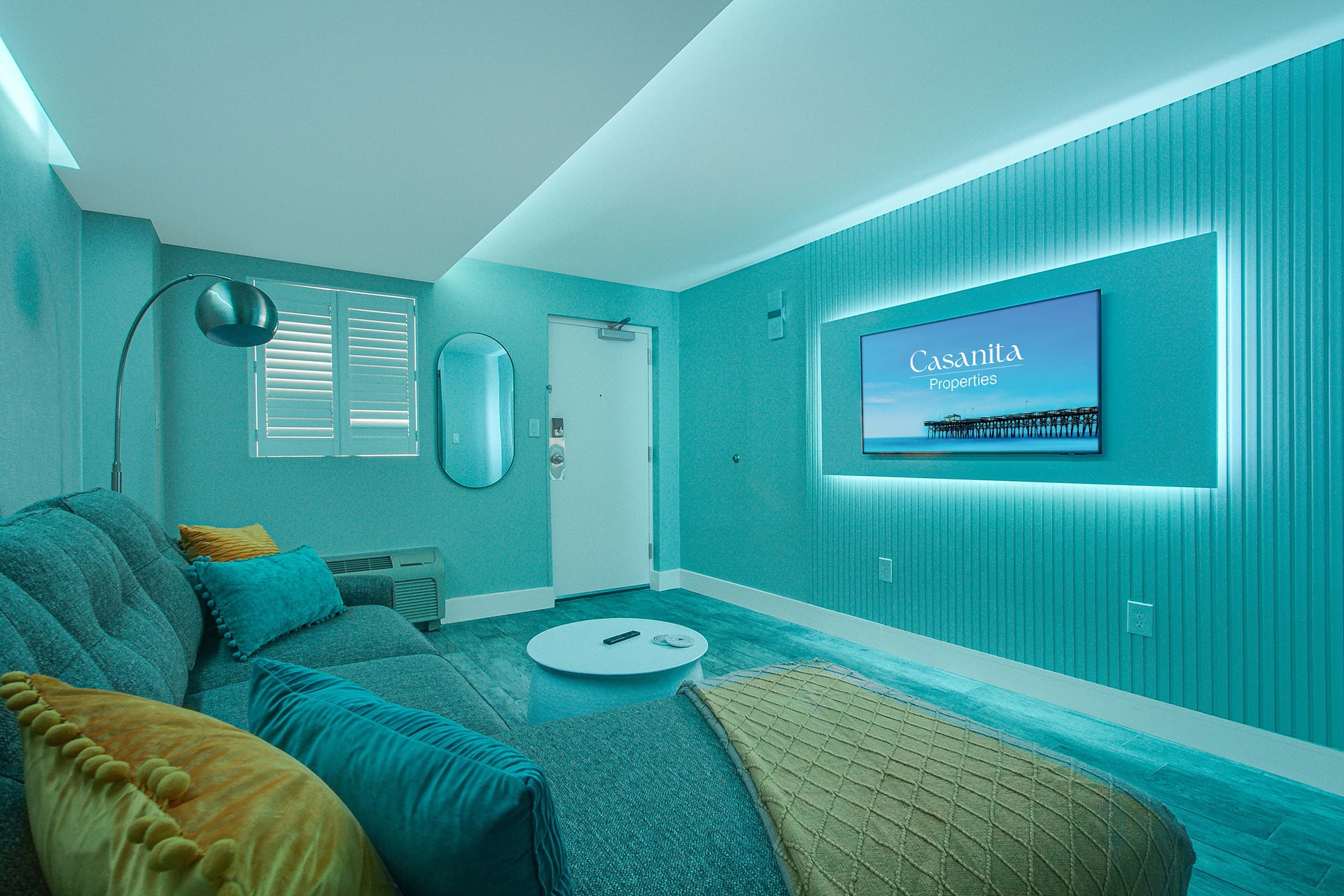 Enhanced by ambient purple lighting that sets a relaxing mood. The cozy sectional, modern decor, and wall-mounted TV create an inviting atmosphere, perfect for evening relaxation or movie nights in style.