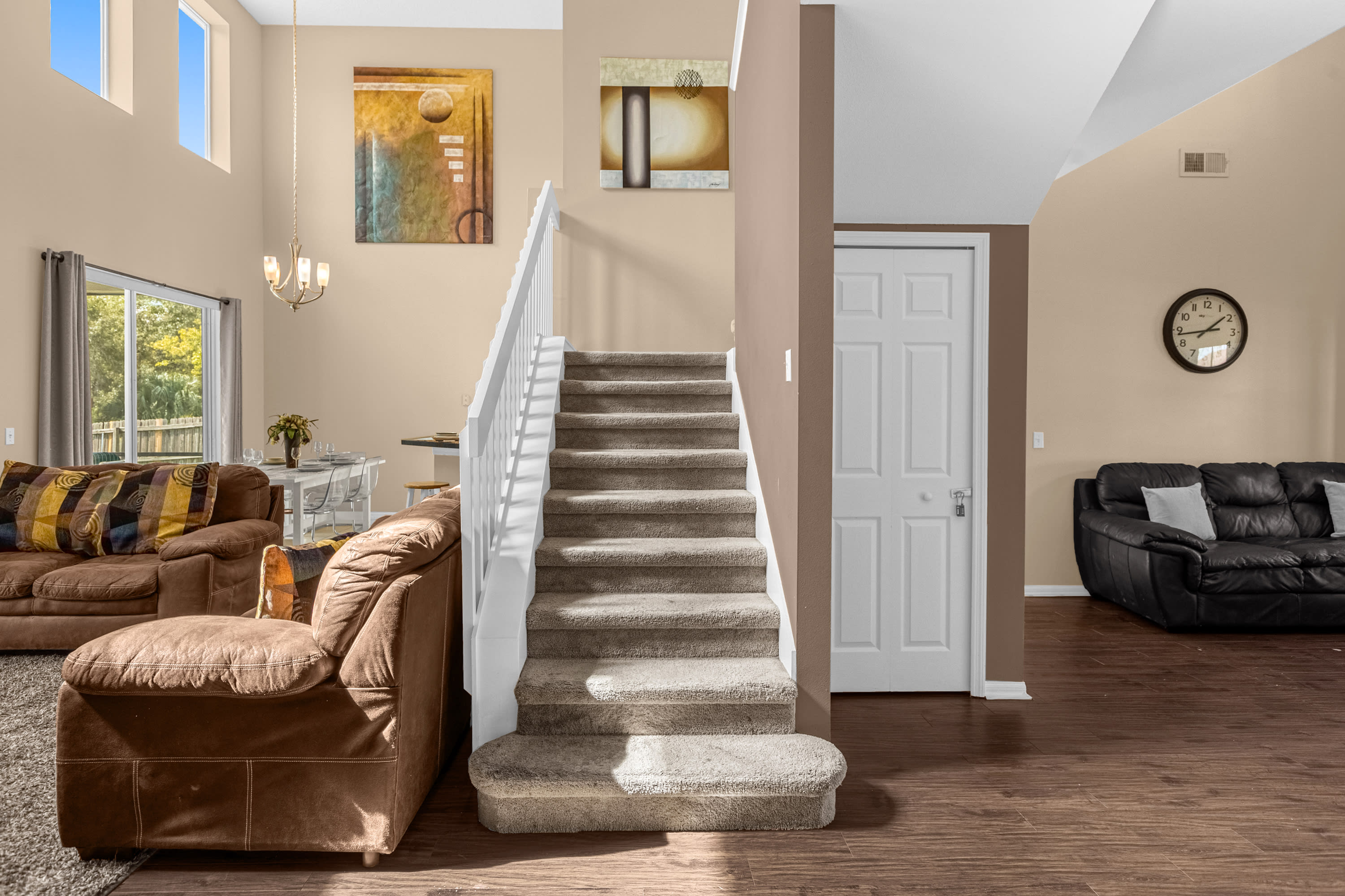 Welcoming Entrance With Modern Staircase And Elegant Decor