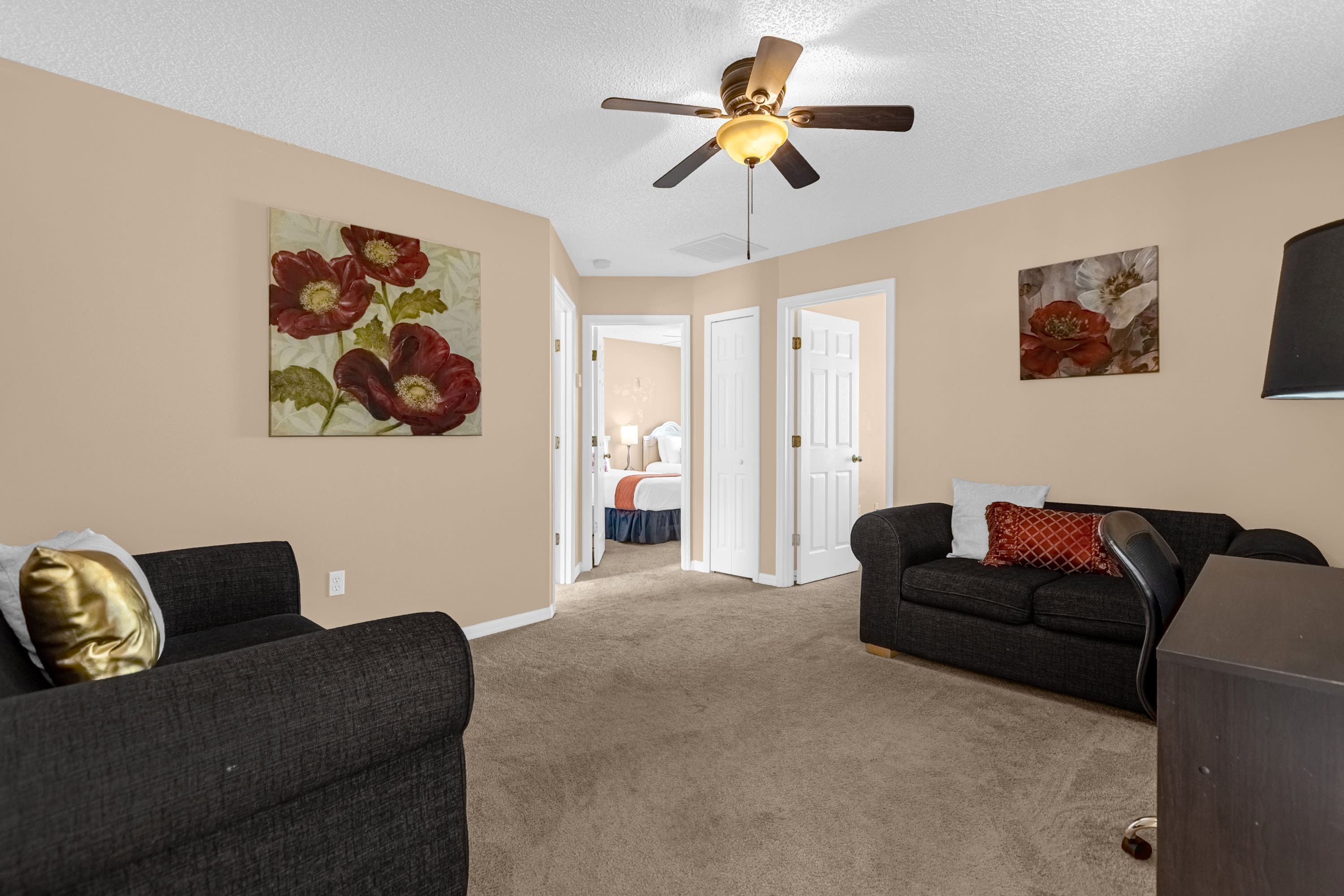 Comfortable Family Room Featuring Plush Seating And Smart TV