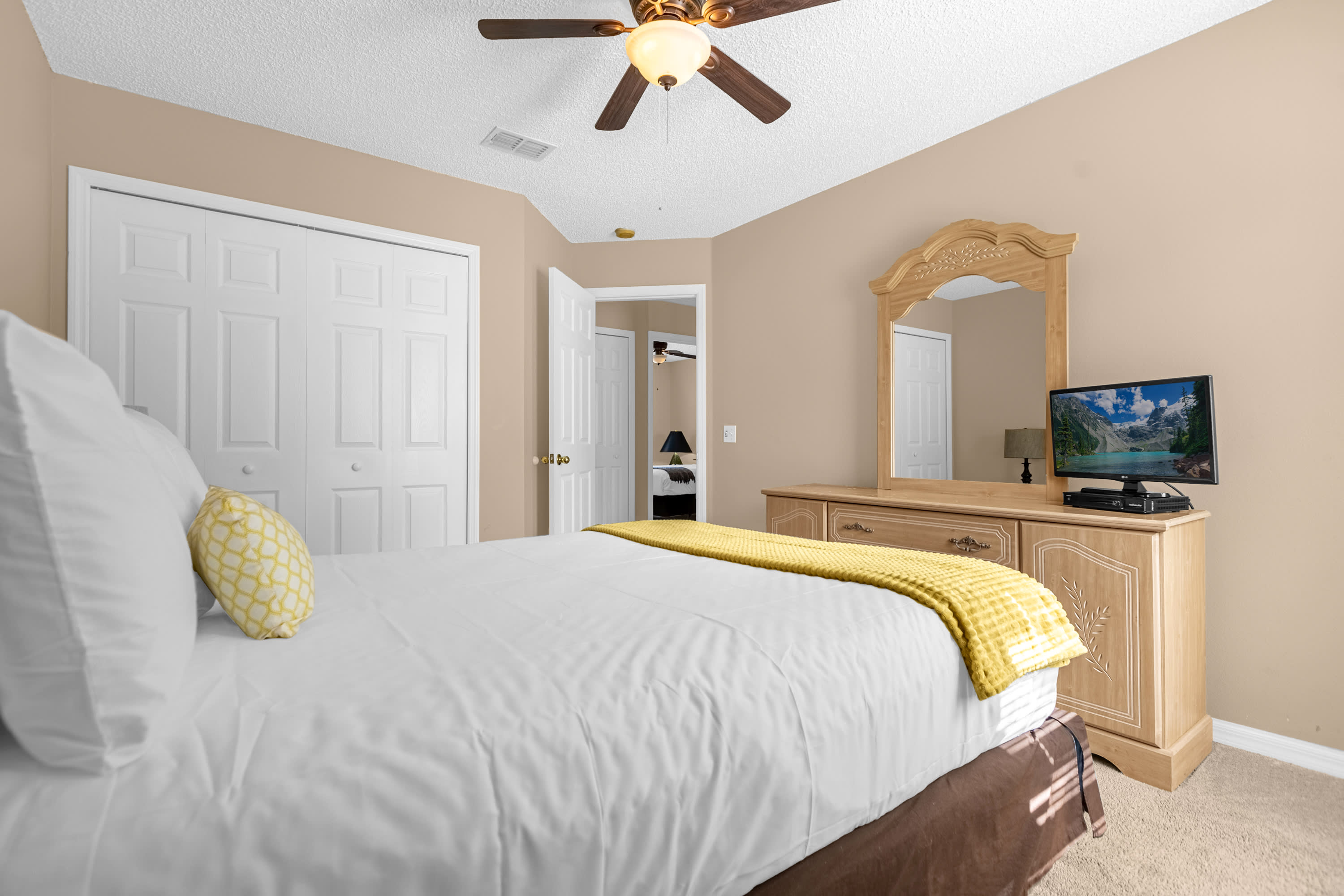 Spacious Master Suite With Plush Bedding And Private Sitting Area