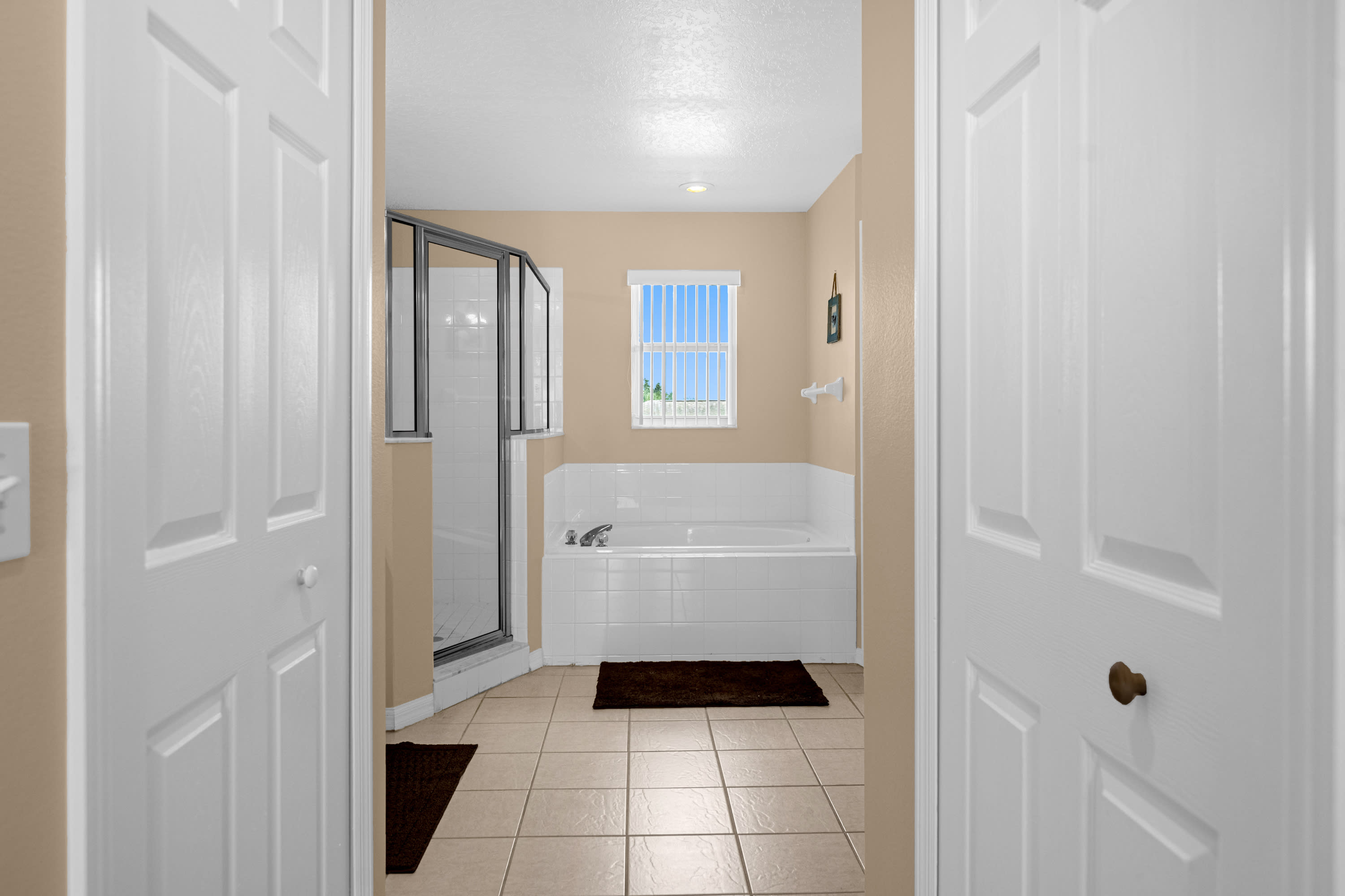 Bathroom With Walk-In Shower And Luxurious Garden Tub