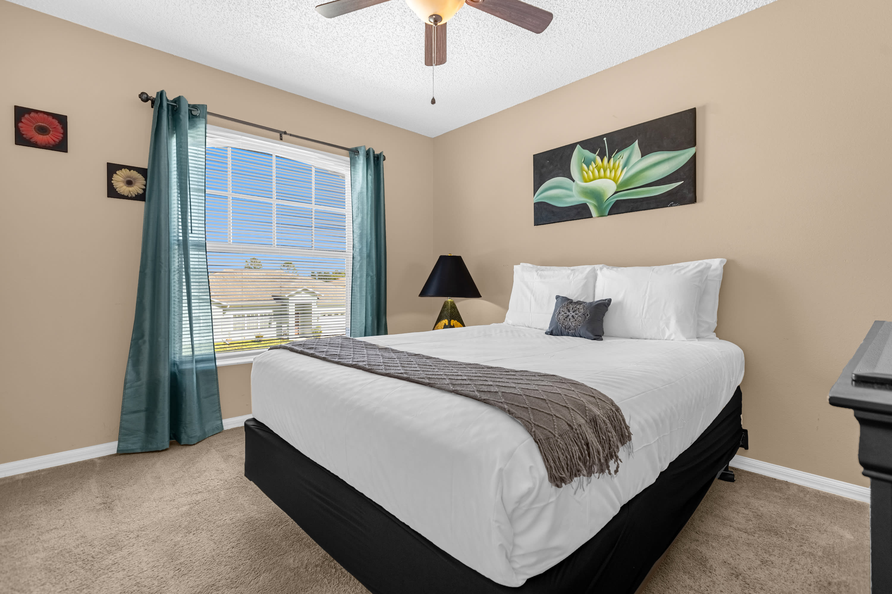Stylish Bedroom Featuring Comfortable Bedding And Warm Tones
