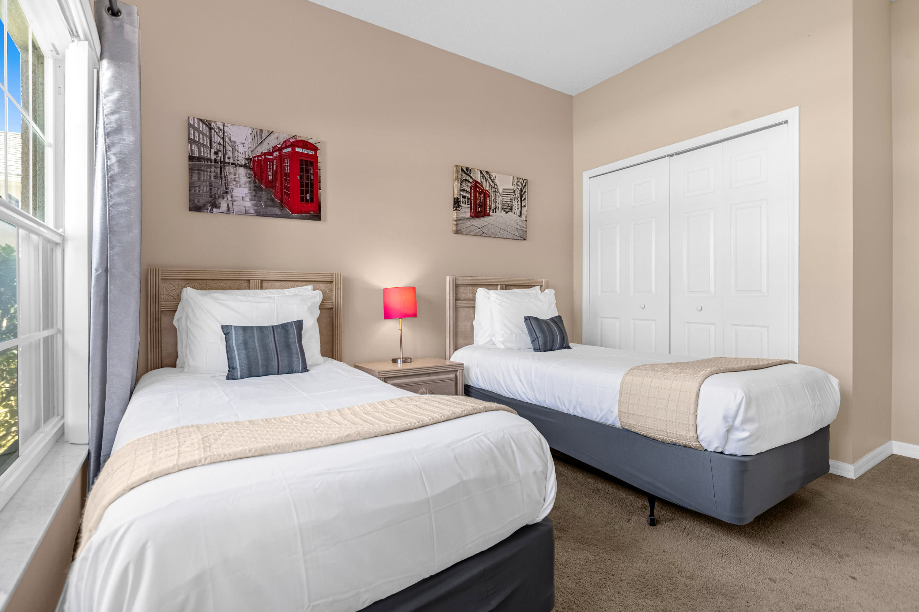 Twin Bedroom With Comfortable Beds And Scenic Views