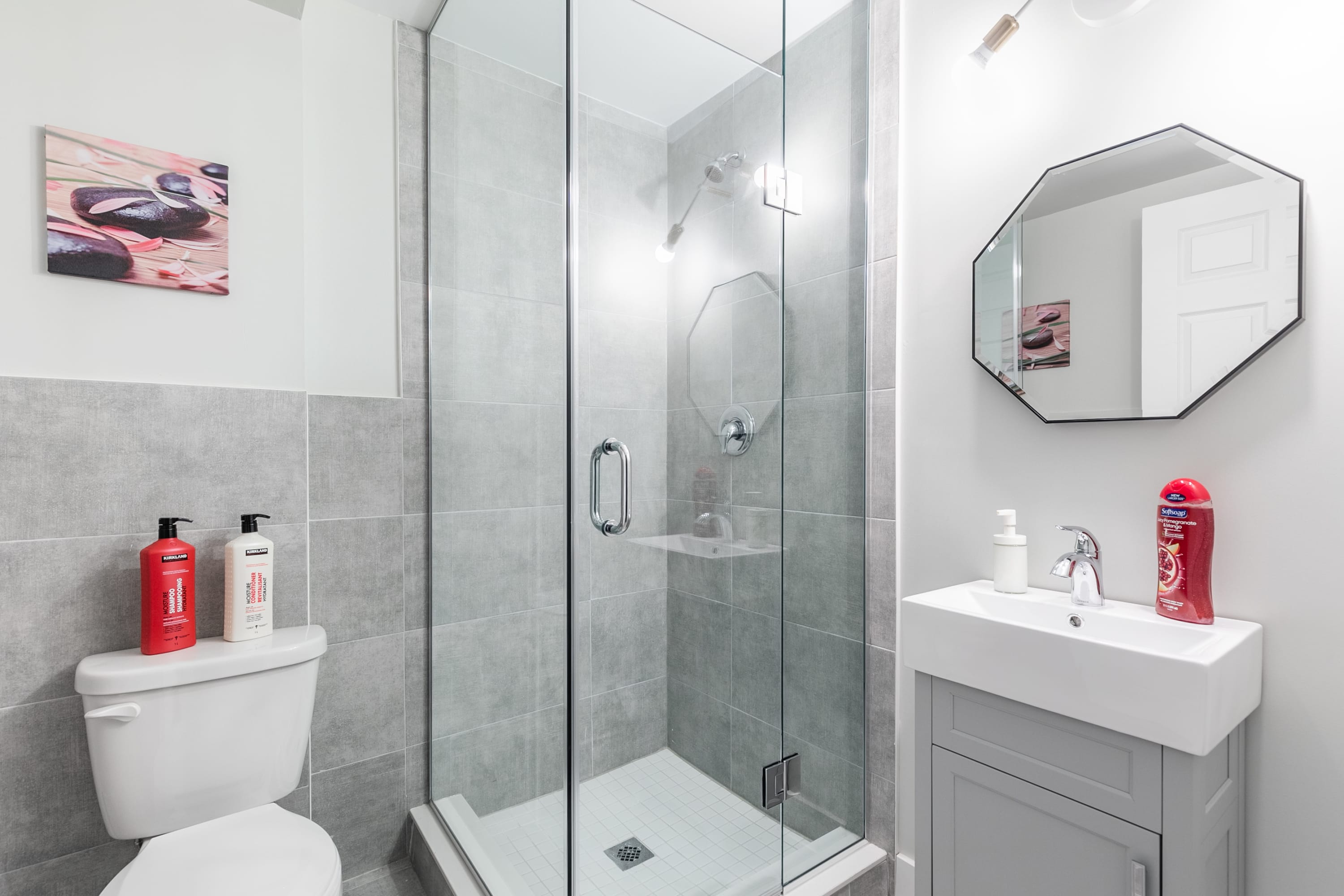 Modern Bathroom With Glass Shower And Elegant Tile Details