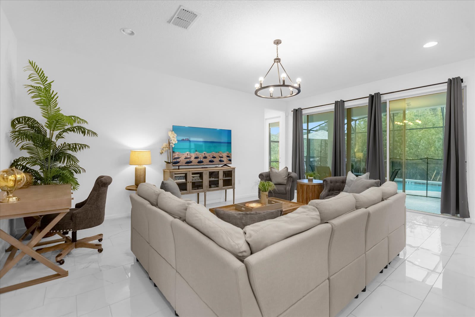 Relax In This Spacious Living Room With Comfortable Seating And A Smart TV