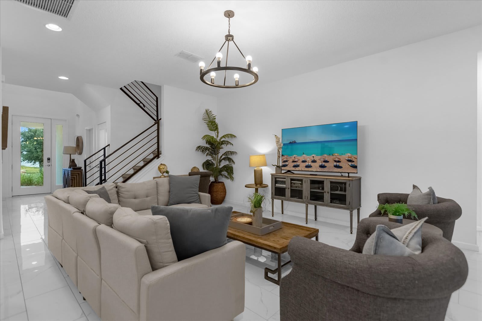 Relax In This Spacious Living Room With Comfortable Seating And A Smart TV