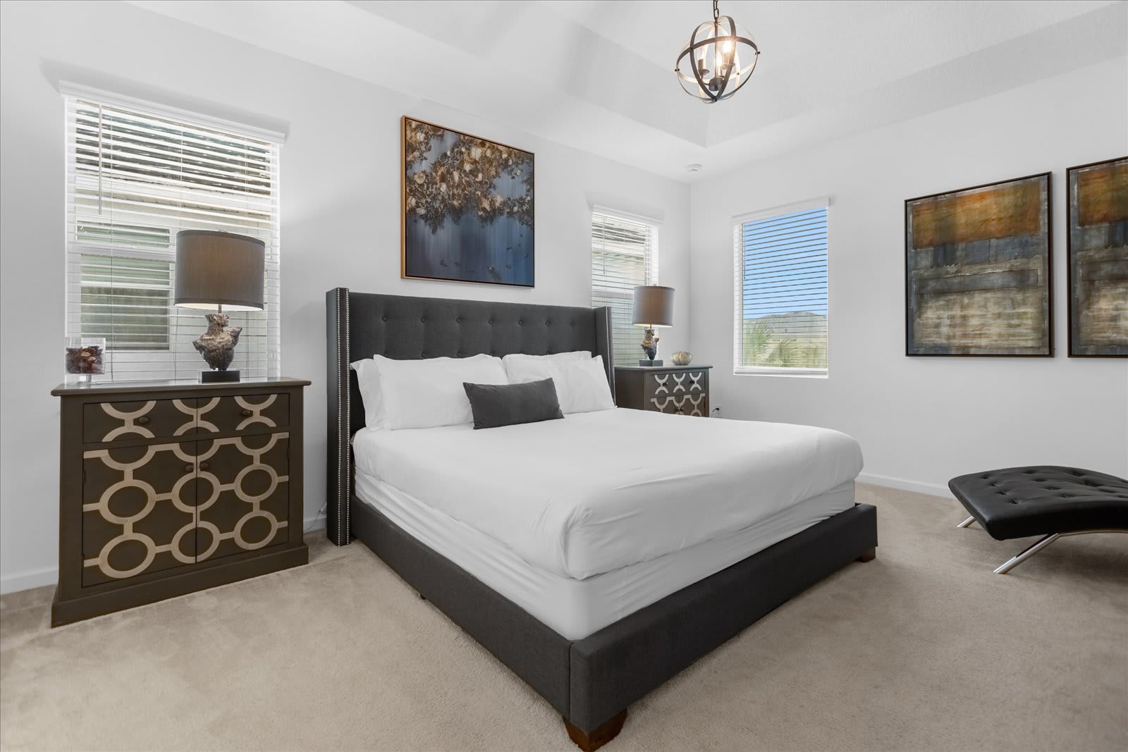 Rest Comfortably In This Queen Bedroom Featuring Modern Geometric Decor