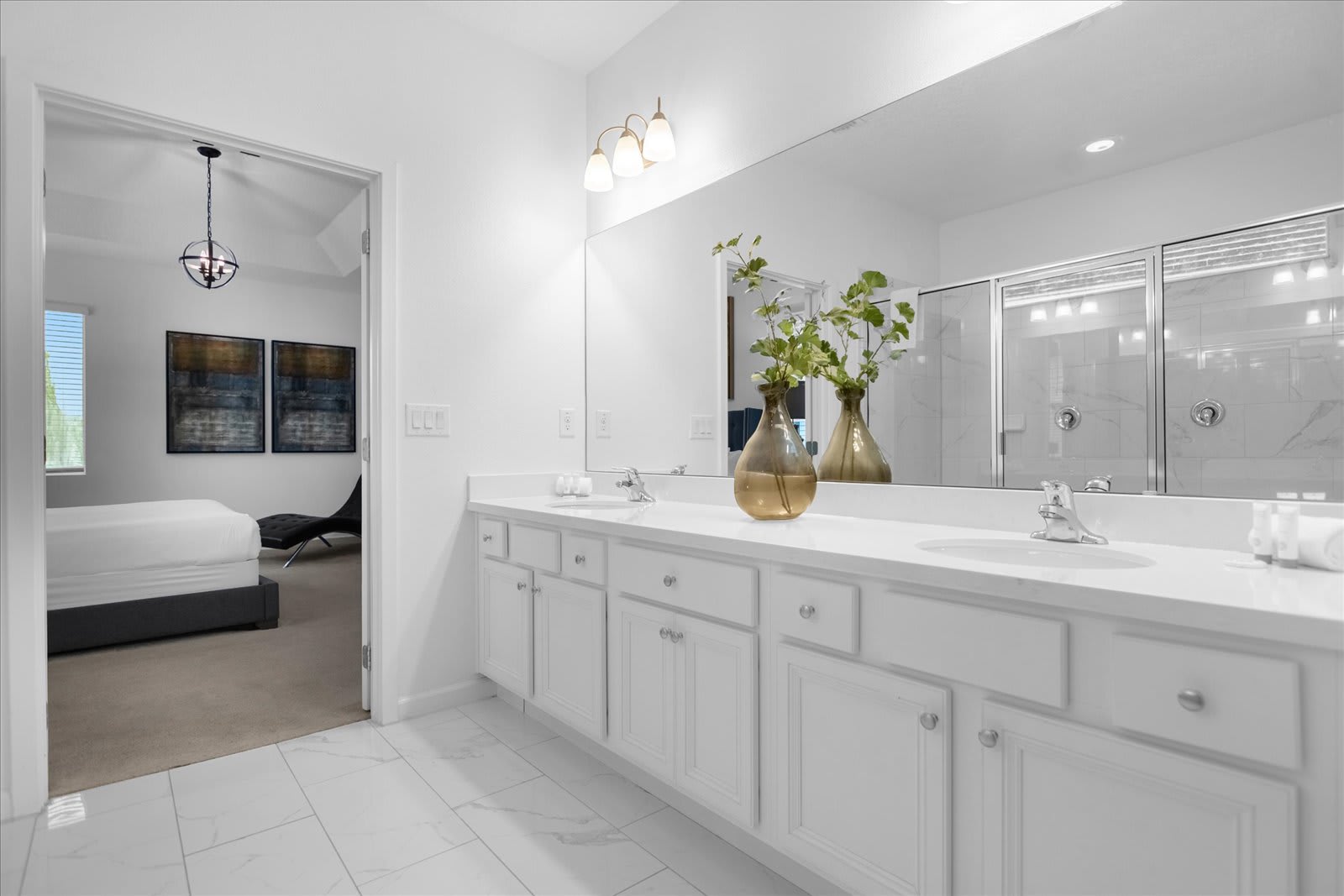 Luxurious Bathroom Featuring A Double Vanity And Elegant Gold Accents