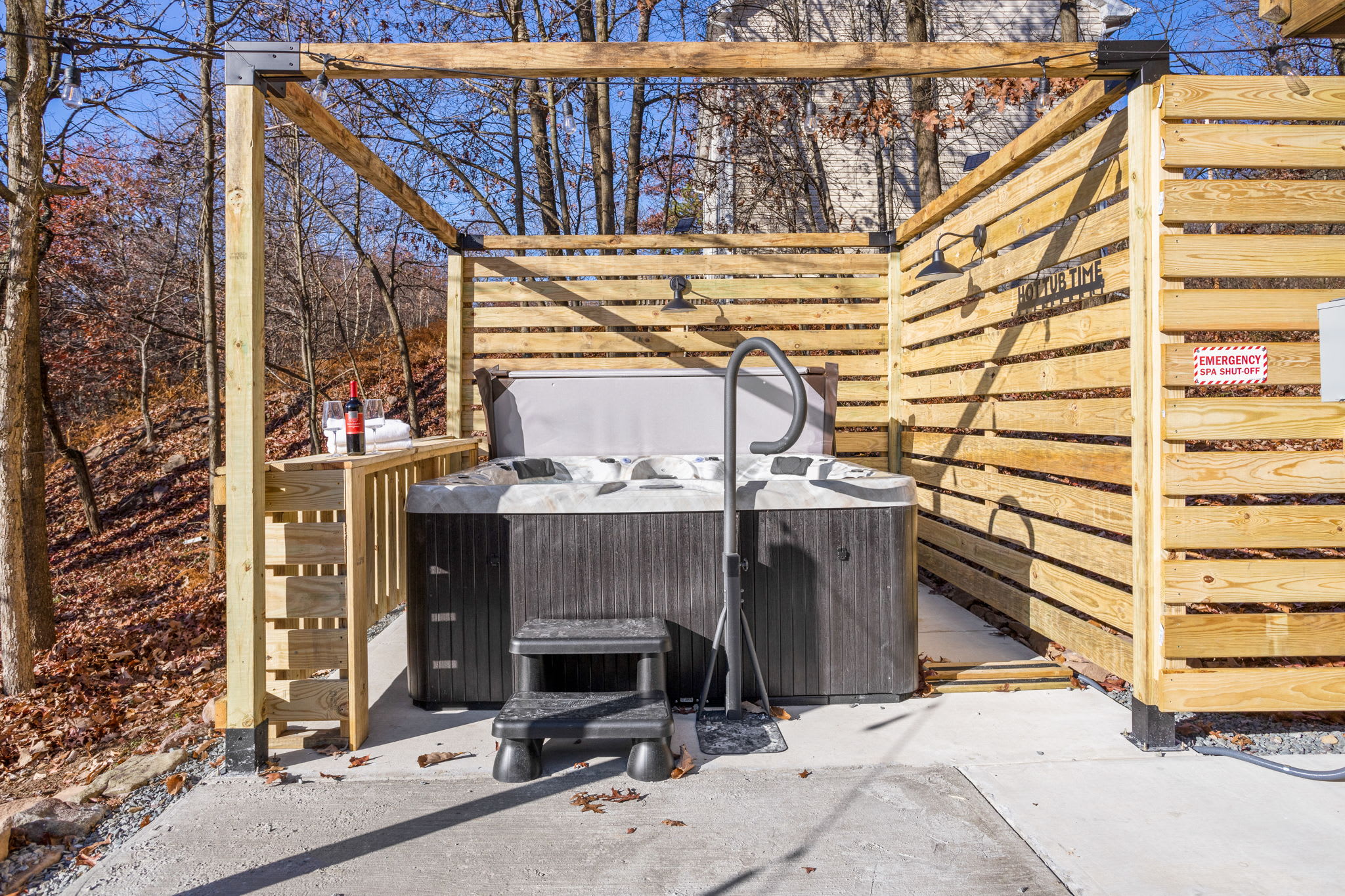 Whether day or night, this private hot tub area offers a relaxing escape surrounded by nature.