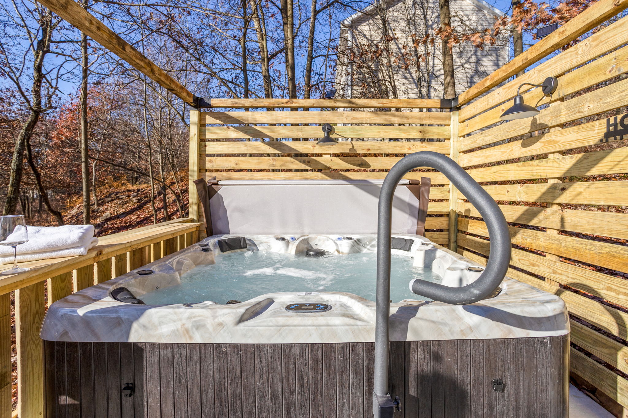 Let the warm jets melt away stress in this beautifully designed hot tub retreat, perfectly positioned for ultimate tranquility.