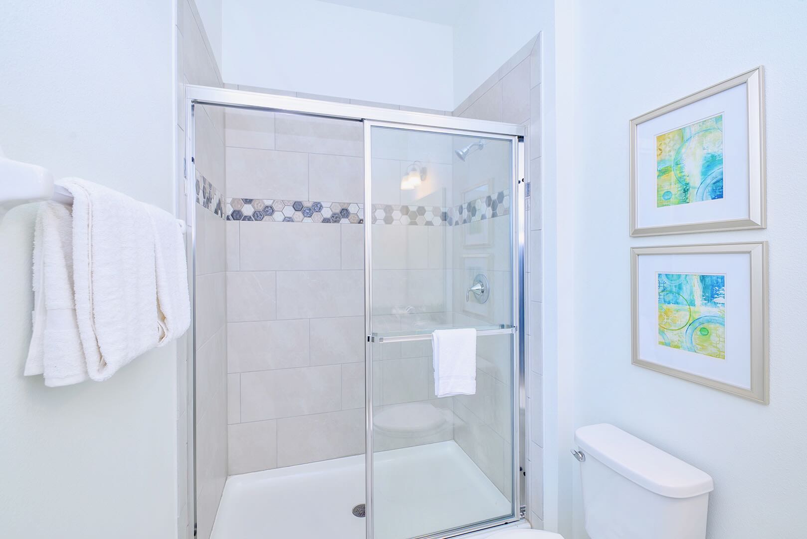 Functional Bathroom Featuring A Spacious Vanity And Fresh Linens