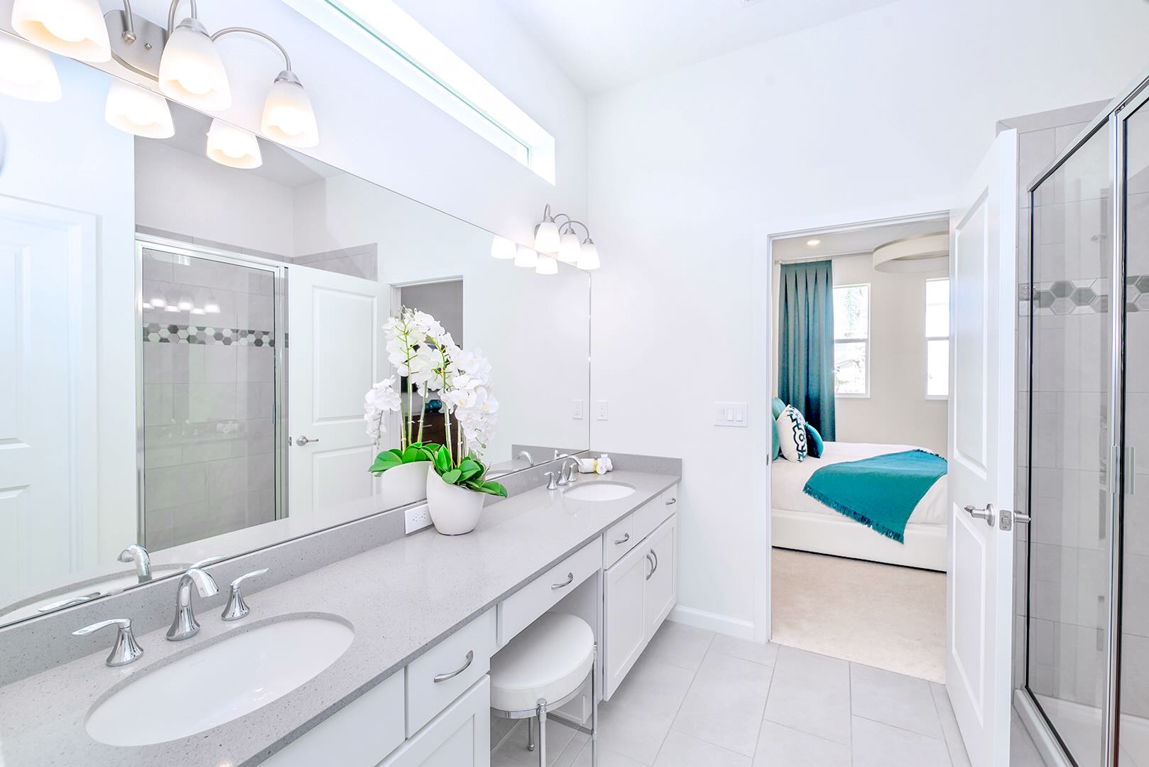 Functional Bathroom Featuring A Spacious Vanity And Fresh Linens