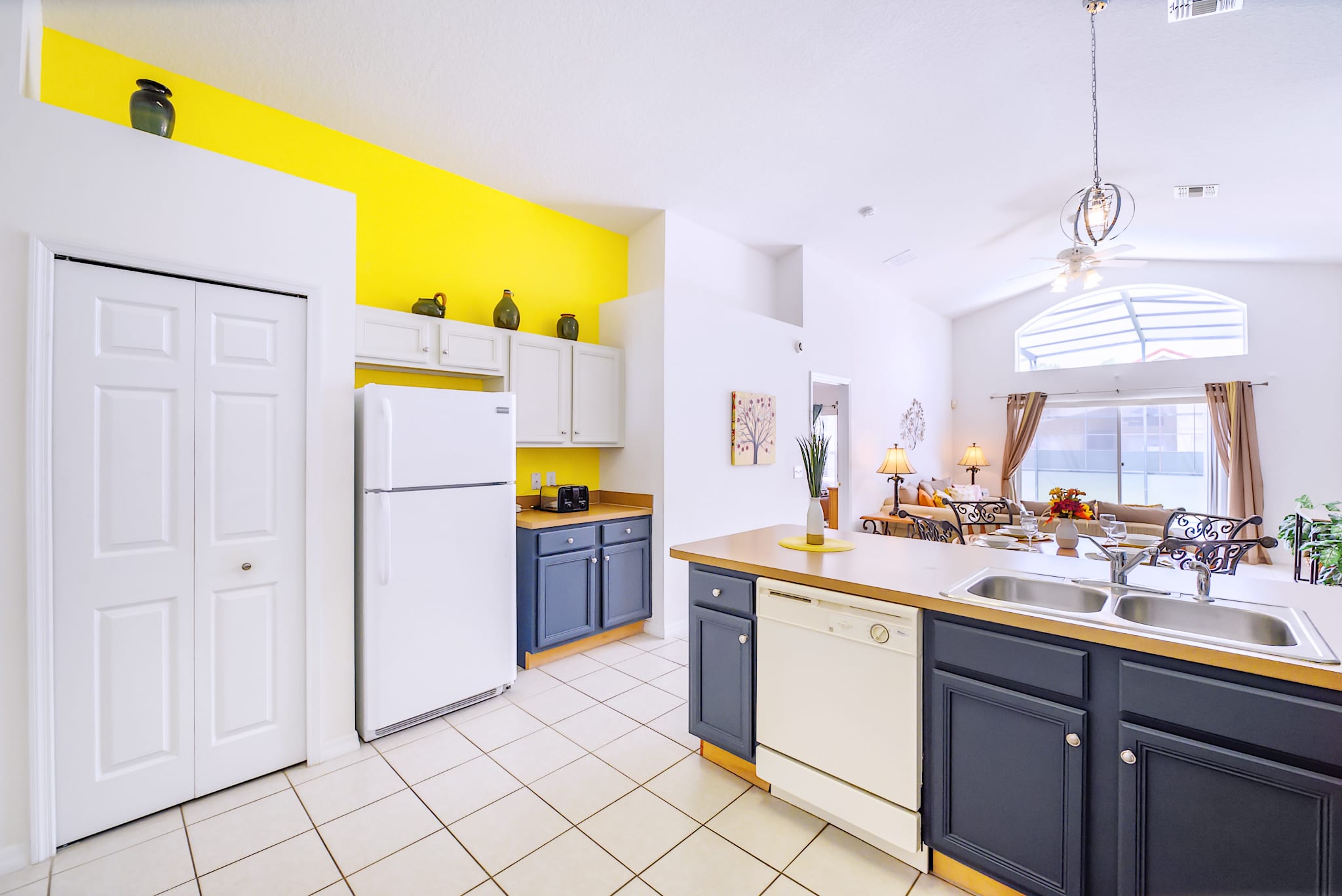 Stylish Kitchen Design With Contrasting Cabinetry And Natural Light