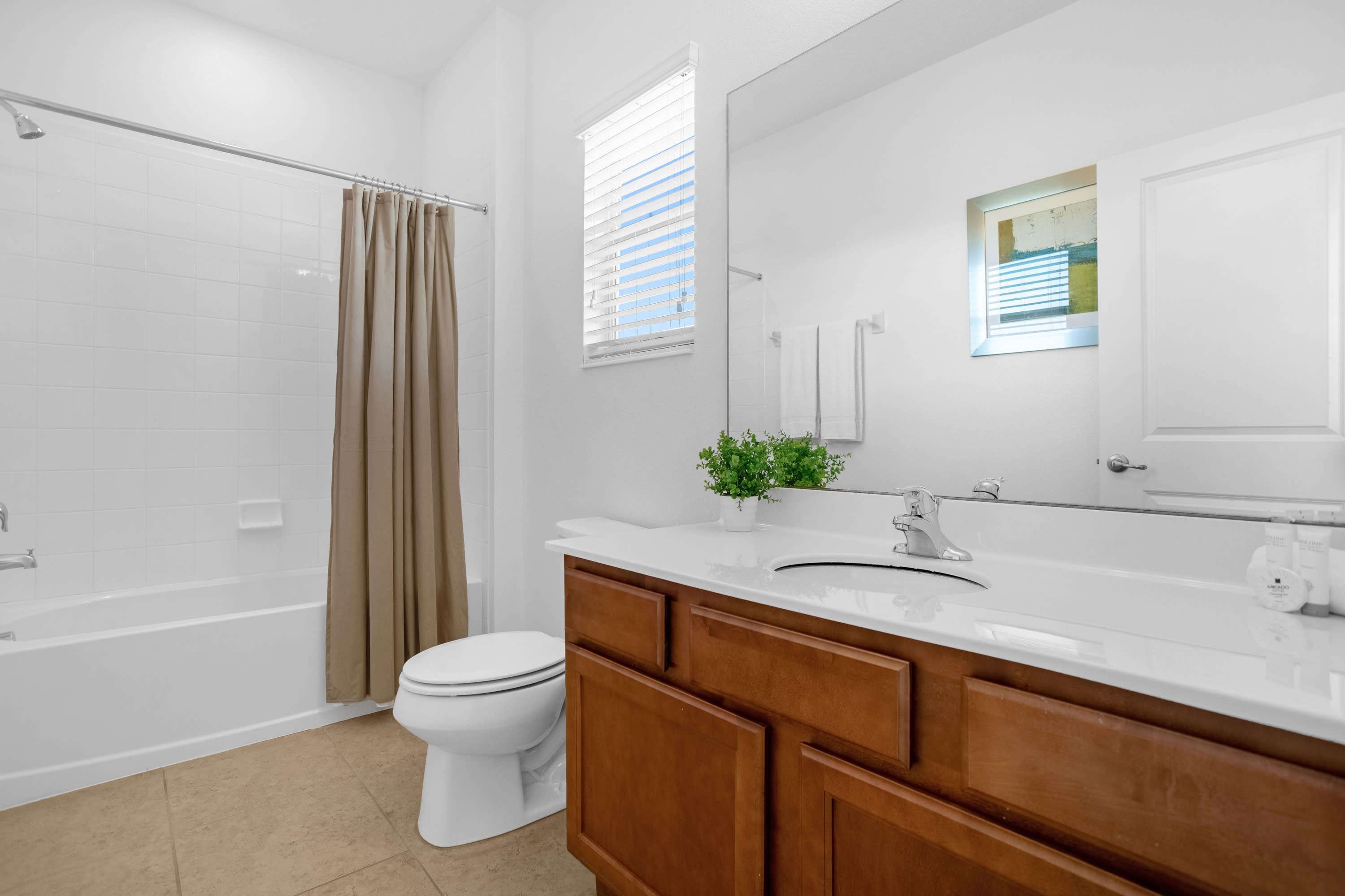 Spacious Bathroom With Dual Sinks And Walk-In Shower