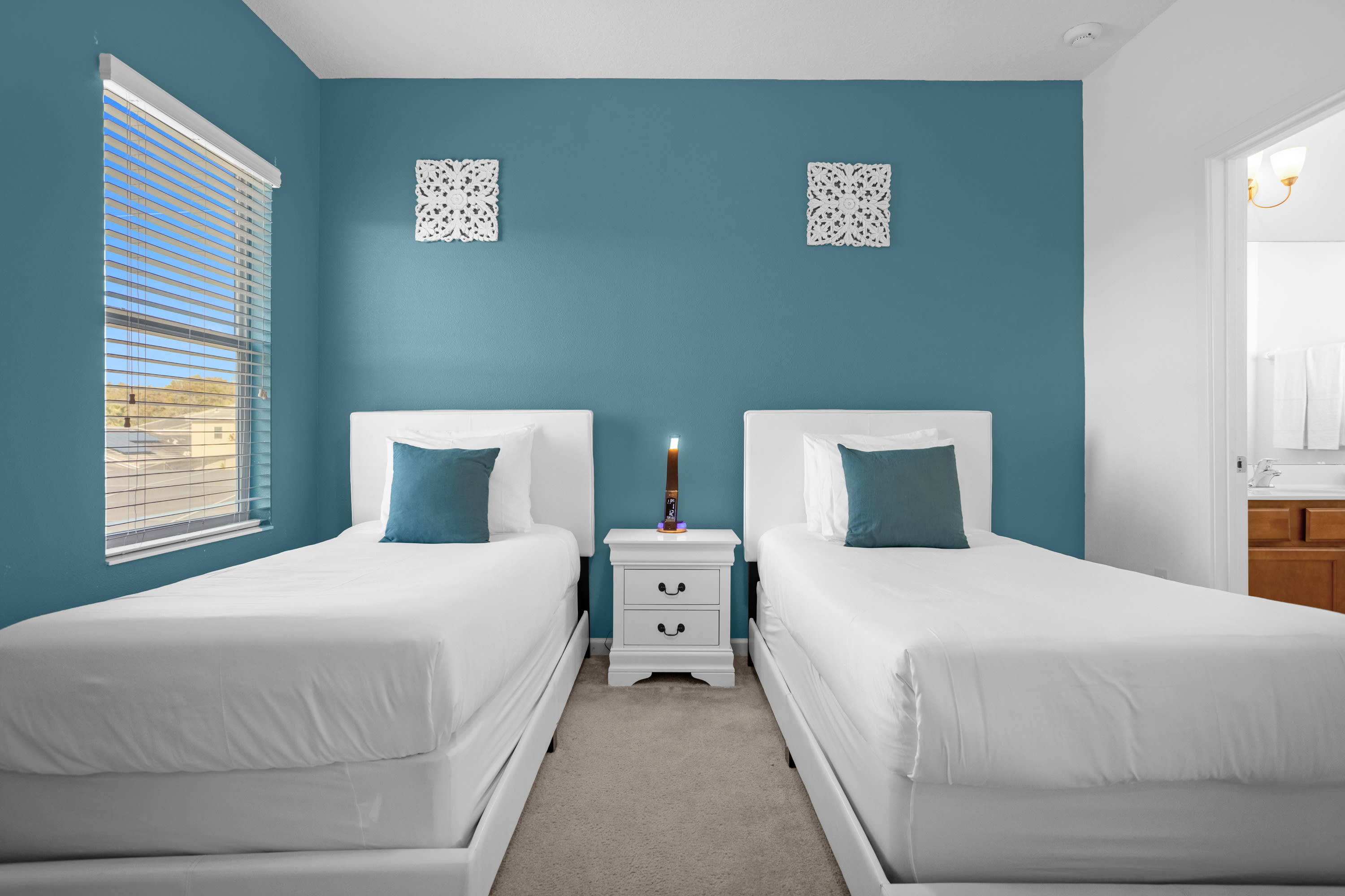 Bright And Airy Room With Twin Beds And Modern Touches