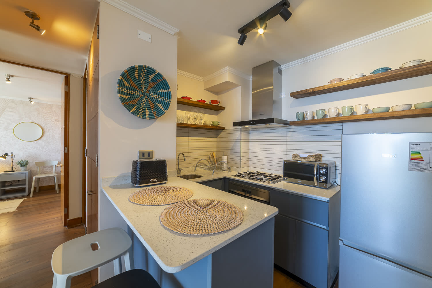 Chic and functional kitchen with modern amenities, perfect for cozy meals in your stylish Chilean apartment.
