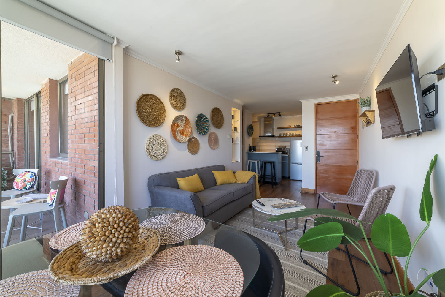 Relax in this stylish living room with vibrant decor and a cozy balcony, perfect for unwinding after exploring the city.