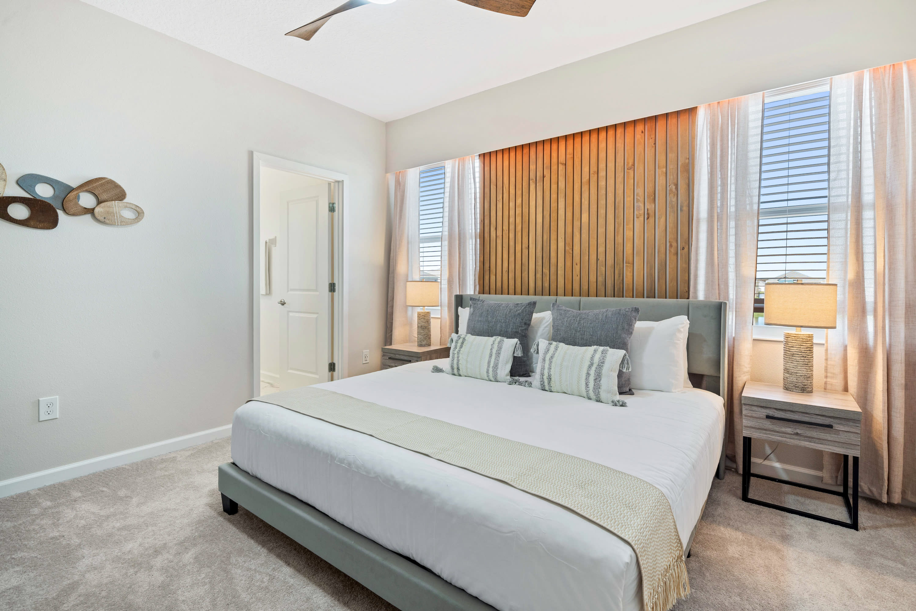 Spacious Bedroom Featuring A Luxurious King-Sized Bed And Stylish Decor