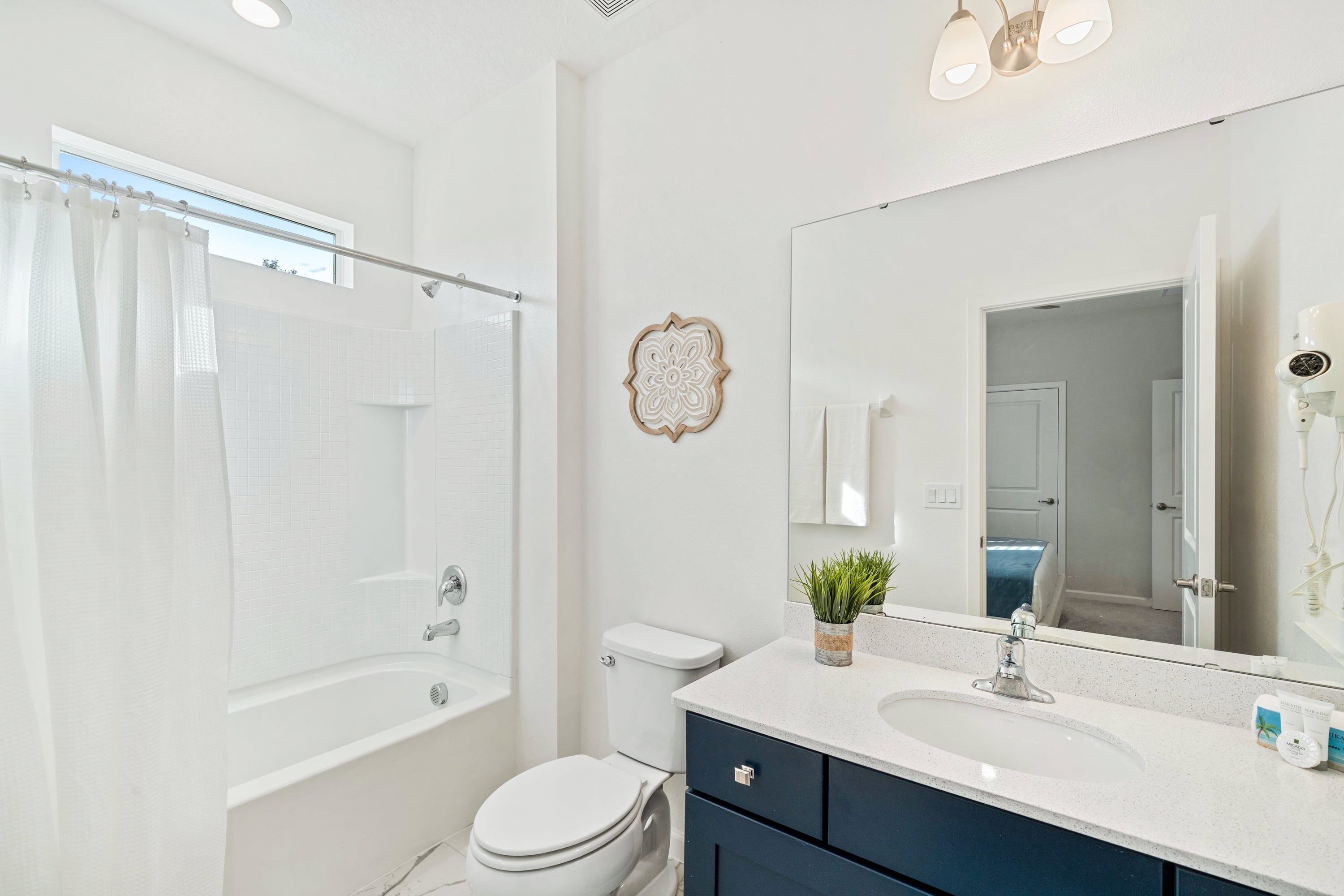 Bright Bathroom With A Clean Design And Elegant Vanity