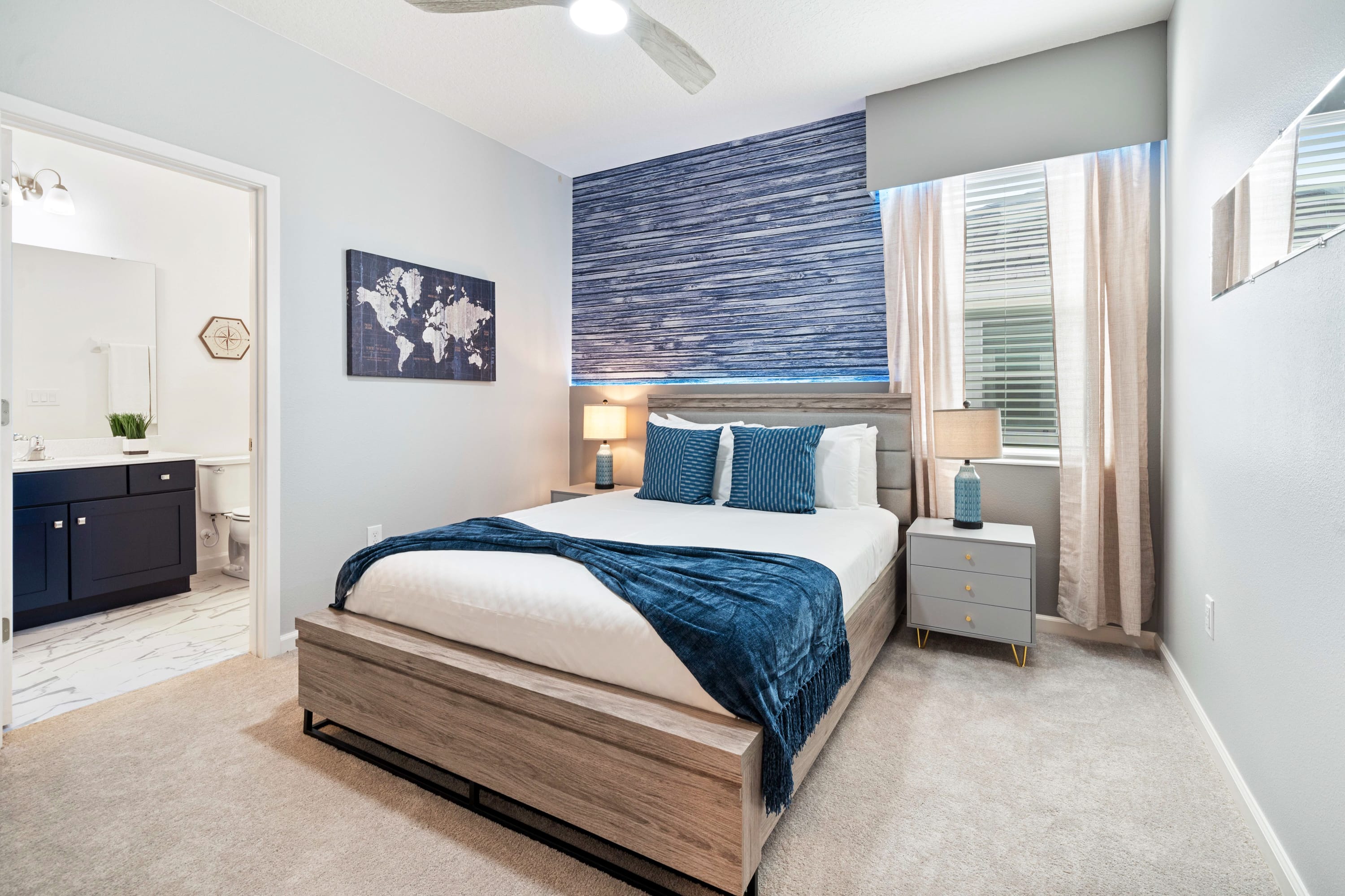 Comfortable Queen Bedroom With Elegant Decor And Natural Light