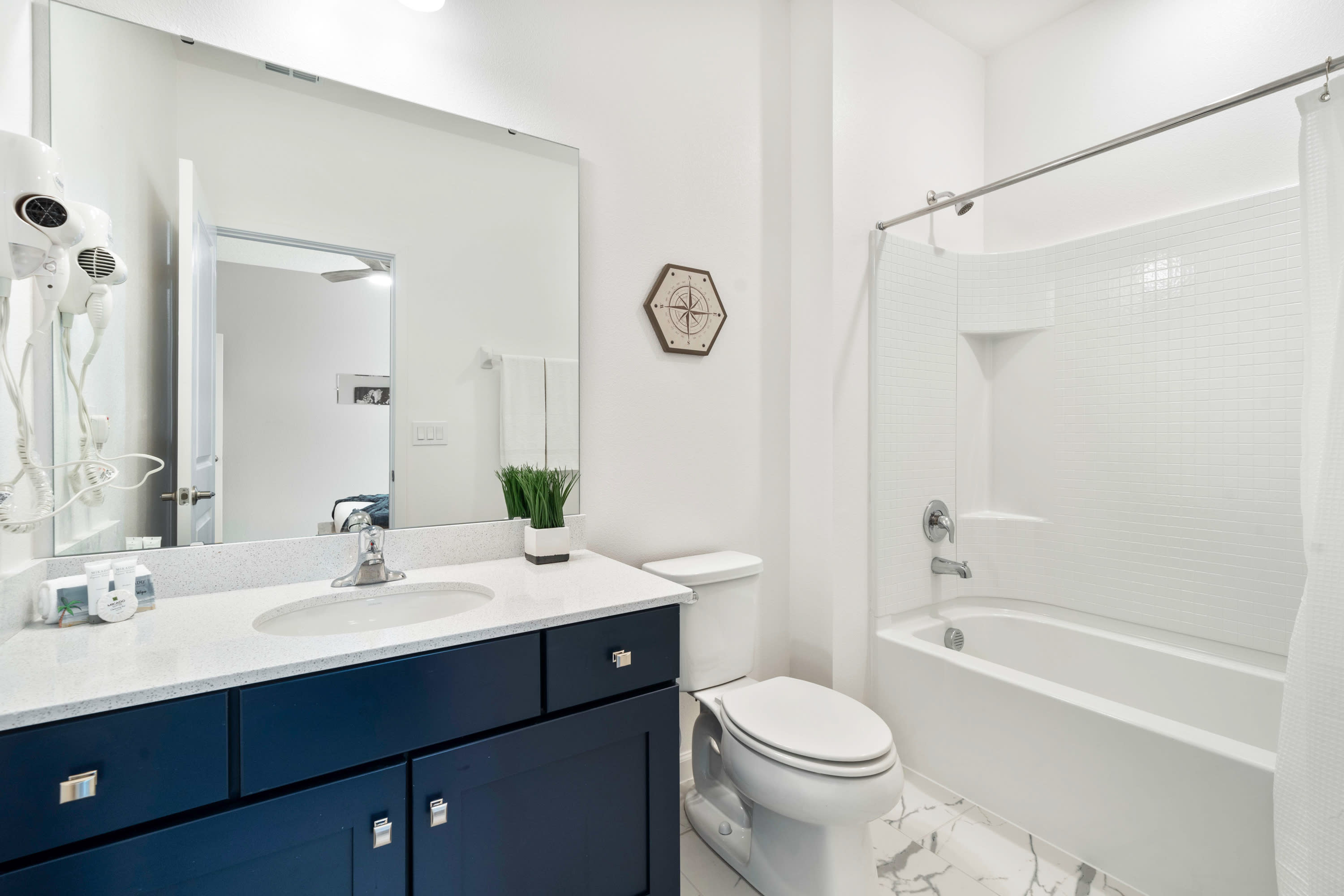Bright Bathroom With A Clean Design And Elegant Vanity
