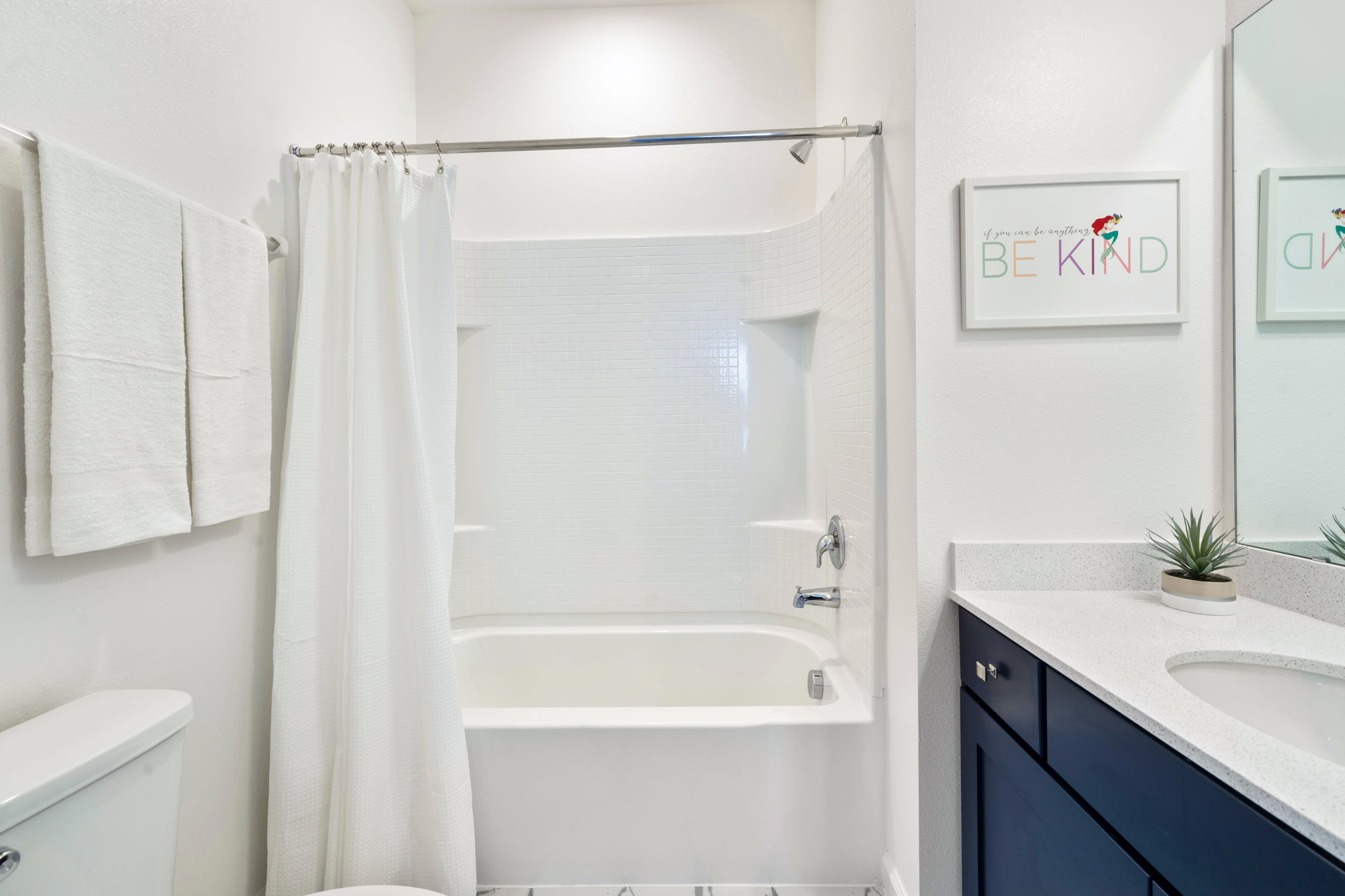 Bright Bathroom With A Clean Design And Elegant Vanity